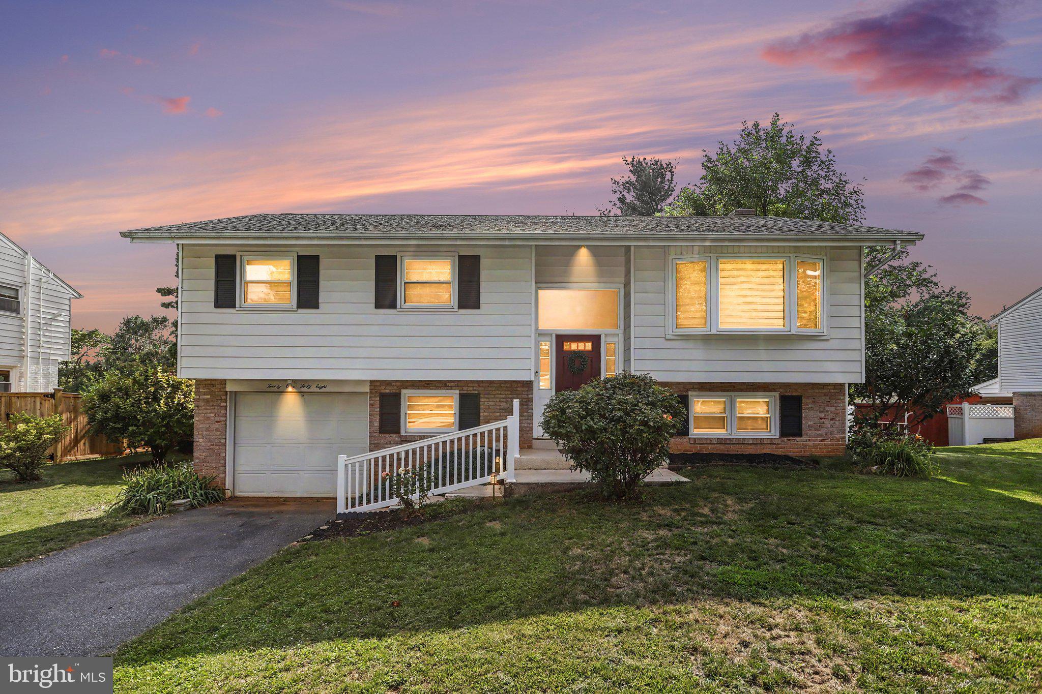 Welcome home to this well-maintained bi-level nestled in a desirable neighborhood, conveniently located within walking distance to local schools and parks. Situated on a spacious lot, level backyard, this property offers the perfect blend of comfort, functionality, and outdoor enjoyment.

The main level features a bright and inviting living room, an adjacent dining area, and well-appointed living spaces ideal for everyday living and entertaining. Many rooms showcase timeless hardwood flooring, while updated vinyl tilt-in windows provide energy efficiency and easy maintenance.

Step outside through the sliding glass door into the sunroom overlooking the private backyard—perfect for relaxing, grilling, or hosting family gatherings. The lower level offers additional finished living space, including a cozy family room with a fireplace, built-in shelving, and convenient walk-out access to the patio and yard.

Additional highlights include an attached garage, mature landscaping, and numerous updates throughout the home. Whether you're looking for extra space, a great location, or a move-in-ready property, this home checks all the boxes. Schedule your private showing today!