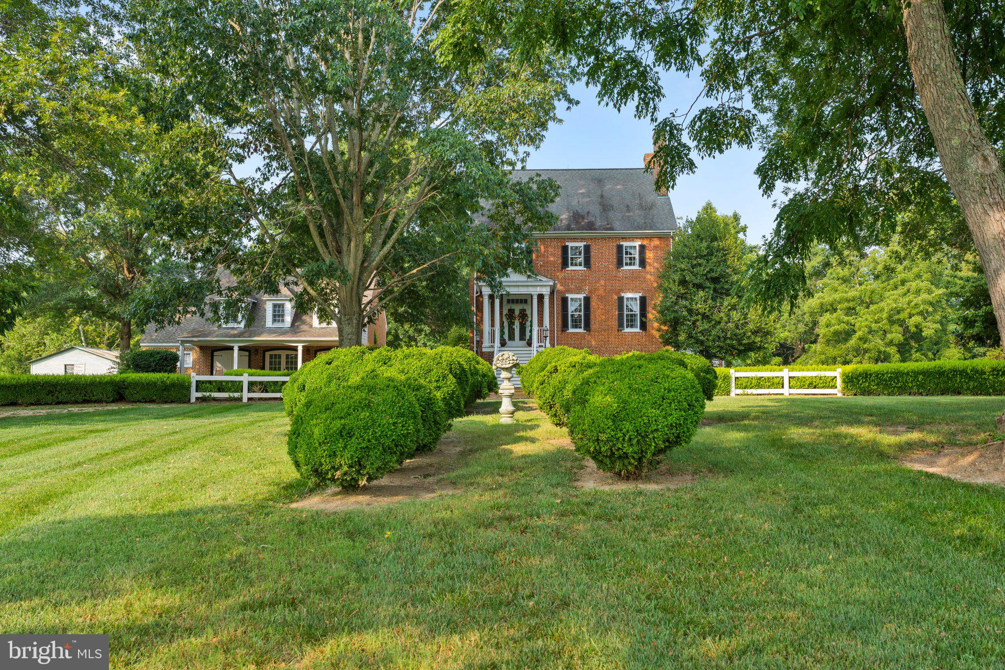 This beautifully maintained and preserved 2 1/2 story side-hall Federal is built upon a high English Basement and sited in the midst of 204 pastoral acres, in the Occupacia Historic District. This wonderfully scenic area, north of Tappahannock, contains numerous historic farms and estates comprising some of the loveliest and most iconic  properties in Eastern Virginia. Linden is ideally suited for use as a single family home, bed and breakfast or wedding-event venue. The main house circa 1735 (according to Essex County records) features original pine floors, staircases, moldings, mantels and more. The addition of columned exterior porches with pediemented porticos, in the 20th century, adds to the sublime elegance that is Linden.    The main house is flanked on one side by a three-bay brick carriage house which contains a large guest suite with fireplace, full bath, other amenities and two additional guest suites above. Cottage gardens, towering ancient trees, terraced lawns complete with pergola and gazeobo provide lots of options for outdoor living and celebrations. A well appointed event venue flanks the other side of the main house with apartment above.  The large expansive lawn in the front  house, the rear and the side pastures is surrounded by mature woodland, featuring rolling topography, meandering streams and  wildlife habitats.  Additional features include: a stocked pond, gazebo, expansive pergola, brick walkways and patios with extensive hardscaping, cottage garden, restored historic barn, towering ancient magnolias and boxwood, terraced lawns, heirloom perennials, rivers of daffodils and so much more. There are no historic or conservation easements on this property, which makes it especially desirable. Wonderfully convenient to Fredericksburg, Richmond, The Northern Neck, and Richmond.  Convenient also to Washington, DC and Williamsburg.