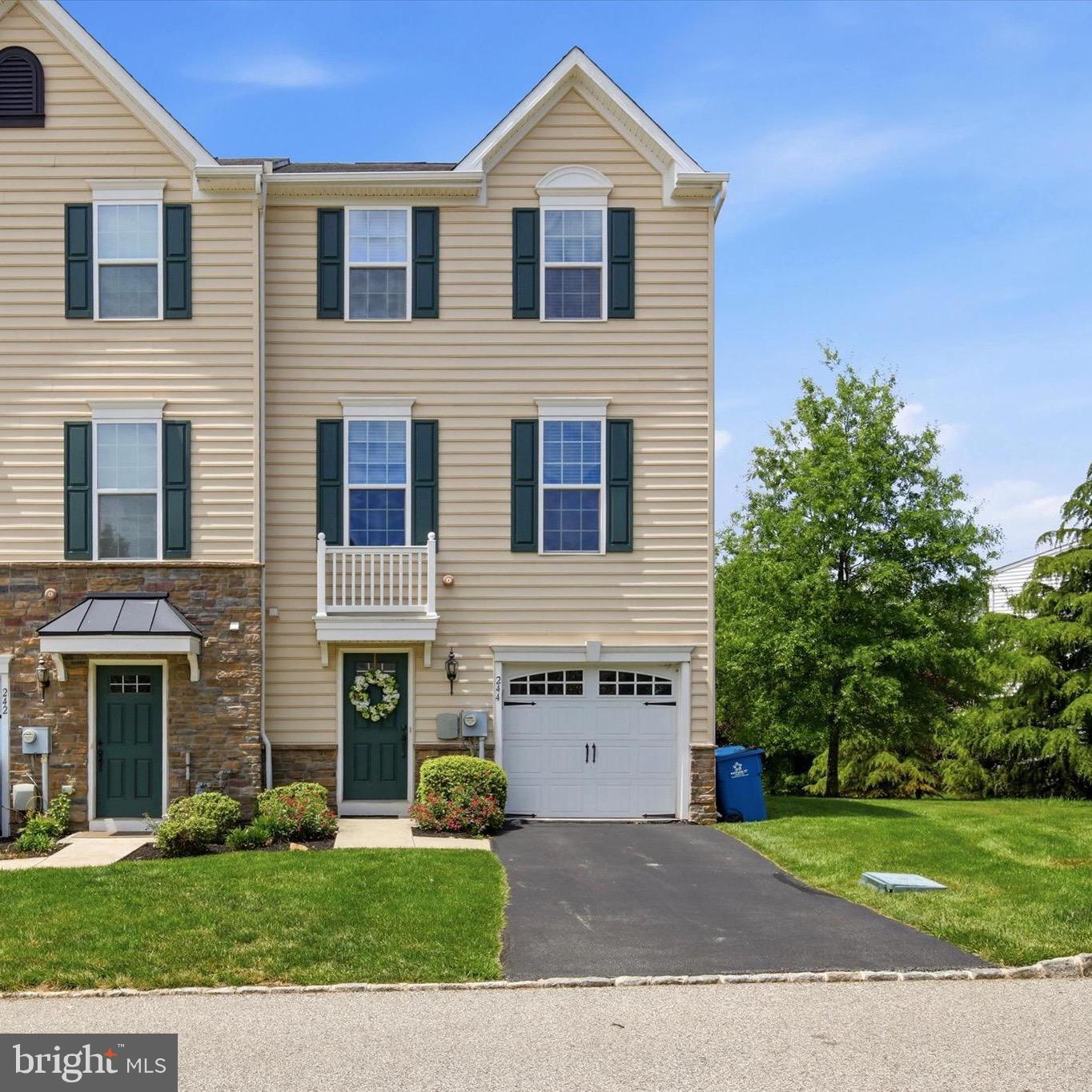 A bright and modern retreat tucked away in a secure gated community that actually offers plenty of guest parking—a rare find! This home is designed for easy living and effortless entertaining across three spacious levels. Step inside the lower level and you’re greeted by rich hardwood floors that flow through a cozy den, boasting a gas fireplace with a classic wood mantle. It’s the perfect spot for a home office or a quiet media room and even has extra storage space.  This level also provides convenient internal access to the one-car garage and a walk-out to a covered patio.  The heart of the home is the main level’s open-concept layout. If you love to cook, the gourmet kitchen is a dream, featuring sleek granite countertops, stainless steel appliances, a pantry, and a central island with seating. Whether you’re grabbing a quick bite at the breakfast table or hosting a dinner party, the space feels airy and connected. Just off the kitchen, a slider opens to a maintenance-free deck that overlooks a surprisingly private backyard—perfect for morning coffee or evening cocktails. An additional breakfast bar overlooks the generous family room, which is absolutely drenched in natural light thanks to oversized windows. Retreat to the upper level where the primary suite serves as a true sanctuary. It features an elegant trey ceiling, a large walk-in closet, and a spa-like en-suite bathroom with a double vanity. Two additional well-sized bedrooms and a second full bath ensure there’s plenty of room for family, guests, or a hobby space. 
Spacious, sun-filled, and perfectly situated—this is the modern lifestyle you’ve been looking for. Close to public transportation and major highways along with plenty of shopping and dining options.