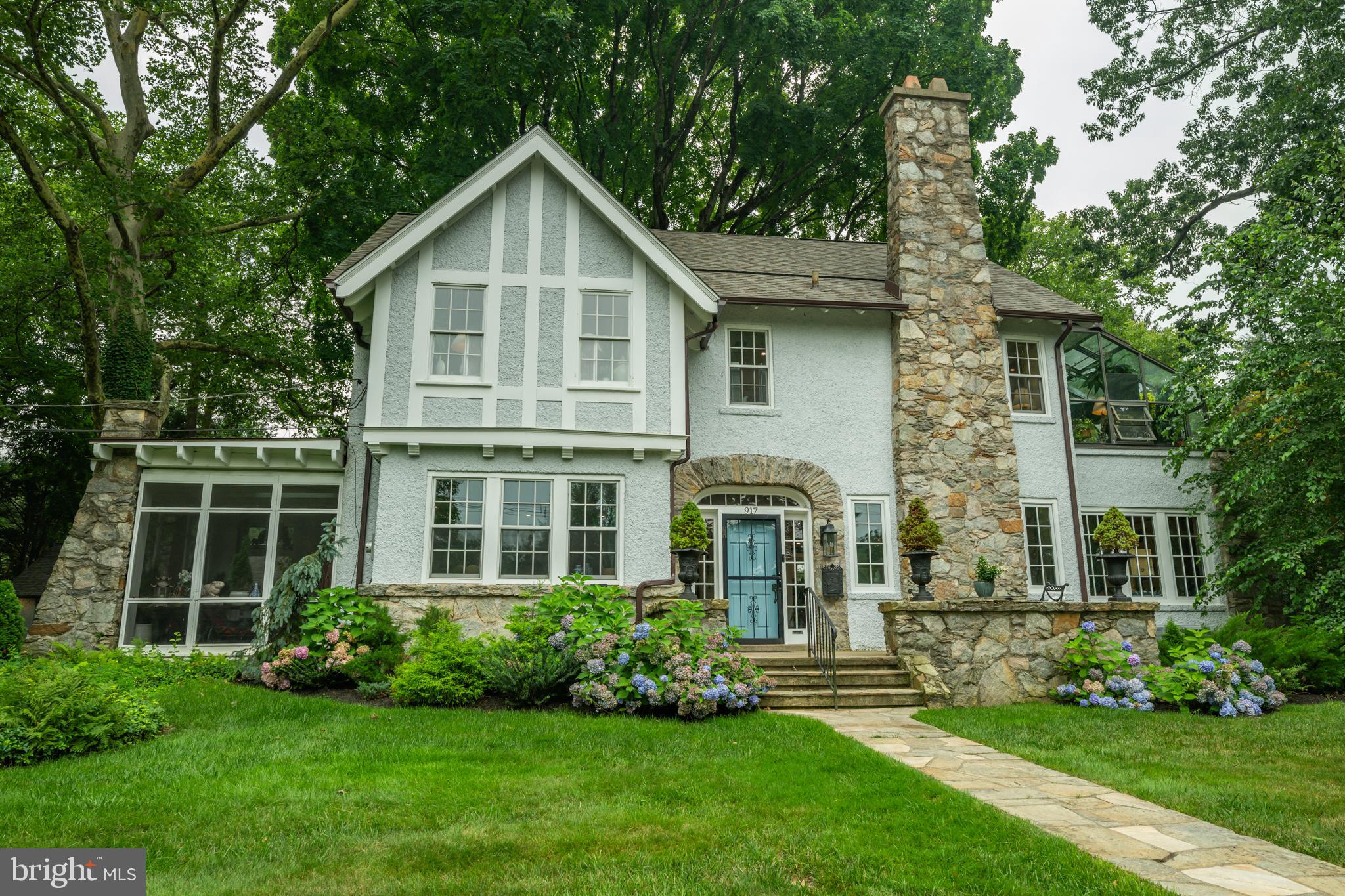 Nestled on a majestic corner lot in one of Yardley's most coveted neighborhoods, Edgehill Gardens, this exceptional  5-bedroom, 4 full and 1 half bath residence built in 1922, seamlessly blends timeless architectural character with the confidence and convenience of modern living.

From the moment you arrive, the striking stone façade, mature landscaping, and detached four-car garage create an unforgettable first impression. Inside, nearly every inch of the home has been thoughtfully restored, renovated, or enhanced over the past four years, preserving its original charm while delivering the comforts today's buyers expect.

The heart of the home is a beautifully reimagined kitchen featuring quartz countertops, marble backsplash, a Wolf range, GE Profile appliances, and custom finishes, opening effortlessly into the dining room through a widened passage with elegant French doors leading to the screened porch. Multiple inviting living spaces, a stunning office with an adjoining full bath, and beautifully renovated bathrooms throughout provide exceptional flexibility for today's lifestyle.

Beyond the cosmetic updates lies what truly sets this home apart: a comprehensive investment in its infrastructure. The home has been completely rewired, features new central air conditioning, new heating and hot water systems, a new plumbing stack, new roof, gutters, and downspouts, along with countless additional improvements that offer lasting value and peace of mind.

Outside, professionally designed landscaping, a new sprinkler system, mature specimen trees, and beautifully maintained grounds create a private setting perfect for entertaining, relaxing, or simply enjoying one of Yardley's most picturesque streets.

Homes of this caliber rarely become available. Rich in character, meticulously maintained, and thoughtfully modernized, 917 Greenway Avenue offers the rare opportunity to own a true Edgehill Gardens landmark where historic charm meets uncompromising quality.

The home's location places you just 7 minutes from Trenton Transit Center with direct rail service to New York City, approximately 8 minutes to local rail service into Philadelphia, and convenient access to I-95 and Route 1. All of this is within the award-winning Pennsbury School District, making this a rare opportunity to enjoy timeless architecture, modern convenience, and an unbeatable location.