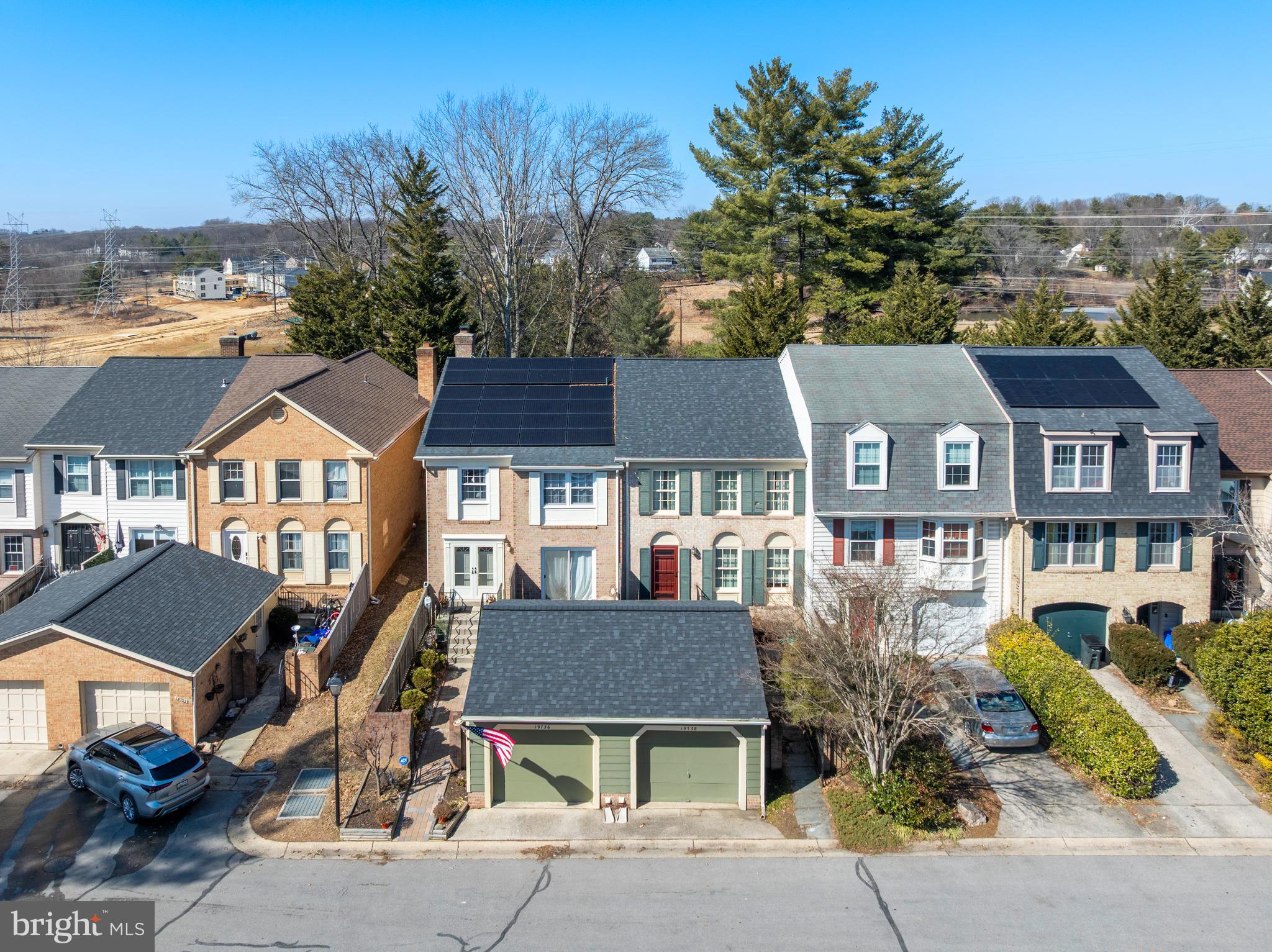 Welcome to this rare opportunity to own one of the larger 2700+ sqft, all brick, 4-bedroom, 3.5 bath townhome located in Greenside of Montgomery Village. This 3-level sun-filled home is in great condition. It has beautiful hard wood floors, a remodeled half bath on the main level, large living room/dinning room area, eat-in gourmet kitchen with brand new stainless steel appliances and granite counter tops, a top level large master suite with fully remodeled master bath room, soaking tub, glassed floor to ceiling tiled shower and a massive walk-in closet, along with two additional bedrooms, a large finished basement with a cozy brick front wood burning fireplace, a front and rear deck with slider access to each. The home also has a large front-load one-car garage (2 additional parking passes included) next to an iron gate fenced main entrance with an attractive refurbished brick walkway/patio, and a fenced backyard. A new roof with professionally maintained solar panels installed in 2018. The community has plenty of guest parking and is a short drive from I-270, the Metro, the MARC train, restaurants, and shopping. Home warranty included.