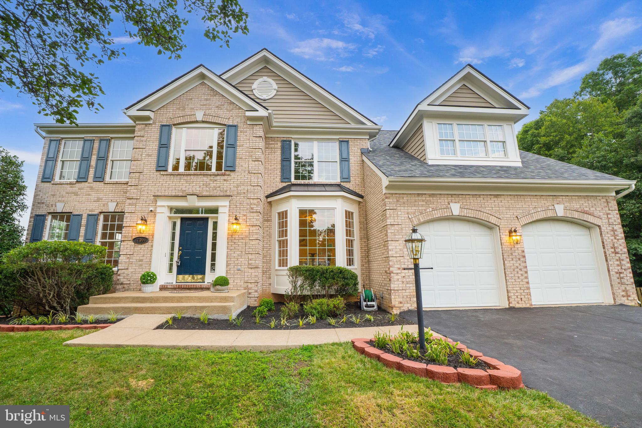 Discover a rare private retreat nestled at the end of a quiet cul-de-sac in sought-after Ridge Oaks, where mature trees and serene wooded views create a peaceful everyday escape. Beautifully renovated in June 2026, this move-in-ready brick-front Colonial offers approximately 4,928 total square feet (4,523 finished) of thoughtfully designed living space, blending timeless elegance with exceptional indoor-outdoor living. Enjoy the perfect balance of privacy, comfort, and convenience just minutes from Potomac Shores, I-95, commuter lots, shopping, dining, golf, and recreation. Extensive June 2026 improvements provide true move-in-ready peace of mind, including a brand-new roof, fresh interior and exterior paint, all-new carpeting, newly refinished hardwood floors, new stove, new microwave, updated lighting in the dining room, kitchen, and deck, a freshly stained deck, and professional landscaping. Backing to tranquil woods with seasonal views of the Potomac Shores Golf Club, this exceptional property offers the lifestyle today’s buyers have been searching for. The inviting brick façade, manicured landscaping, and expansive freshly stained 18 x 20 deck create the perfect setting for morning coffee, outdoor dining, evening sunsets, or simply relaxing while surrounded by nature. Inside, rich hardwood flooring flows throughout the main and upper levels. A dramatic two-story family room with a cozy fireplace and soaring windows fills the home with natural light while showcasing the peaceful wooded backdrop. The open-concept kitchen and breakfast area seamlessly connect to the family room, creating an ideal space for everyday living and effortless entertaining. Formal living and dining rooms provide elegant gathering spaces, while a spacious private study offers the perfect work-from-home office or library. The upper level features an impressive owner’s retreat complete with a generous sitting room—ideal for a reading lounge, fitness area, nursery, or second home office. Three additional spacious bedrooms and a well-appointed hall bath provide comfortable accommodation for family and guests. The fully finished walk-out lower level significantly expands the home’s versatility with a large recreation room, dedicated movie room, fifth bedroom, and full bath, making it ideal for multigenerational living, an au pair suite, extended guests, or additional entertaining space. Residents enjoy outstanding community amenities, including a clubhouse, swimming pool, fitness center, basketball and tennis courts, and playgrounds. Commuters will appreciate being just minutes from the I-95 Express Lanes, commuter lots with direct Pentagon service, the VRE, Quantico, plus a new VRE station (2027) just a few minutes away. Shopping, dining, and entertainment are conveniently located nearby at Potomac Mills, Stonebridge at Potomac Town Center, and the growing Potomac Shores waterfront district. Families will also appreciate the neighborhood elementary school within walking distance and access to the highly regarded Mary G. Porter Traditional School through the specialty school program. Offering five bedrooms, three-and-a-half baths, extensive recent renovations, exceptional privacy, and unbeatable value, this Ridge Oaks gem is far more than a beautiful home—it’s a lifestyle where peaceful natural surroundings, modern comforts, and everyday convenience come together in one extraordinary property. This is a rare opportunity to get more than your money’s worth (Zestimate value on June 29, 2026: $848,800).