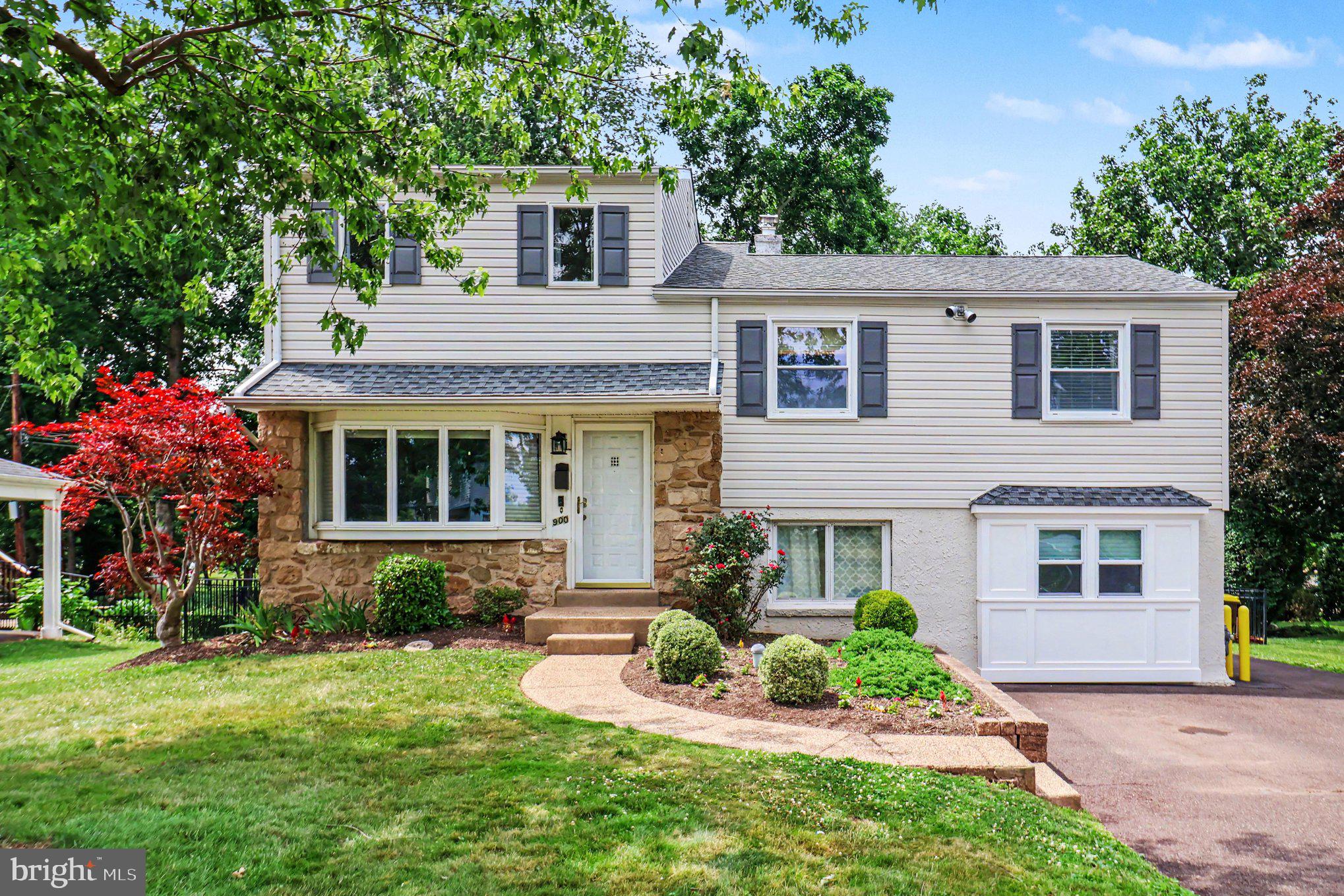 Welcome home to this beautifully maintained 4-bedroom, 2.5-bath split-level home located in the highly sought-after North Penn School District. Offering a spacious and functional floor plan, this home is designed for comfortable everyday living and effortless entertaining. The main level features gleaming hardwood flooring throughout the living room, dining room, and kitchen. The updated kitchen boasts white cabinetry, subway tile backsplash, granite countertops, a farmhouse sink, stainless steel appliances, gas cooking, and plenty of workspace for the home chef. Just off the kitchen, a sliding glass door leads to a low-maintenance composite deck overlooking the fully fenced backyard—perfect for outdoor dining, relaxing, or entertaining guests. The lower level offers a welcoming family room with abundant storage, a generously sized laundry room complete with cabinets and countertop space, convenient access to the backyard, and a powder room. Upstairs you'll find three spacious bedrooms and a full hall bathroom. Privately situated on the upper level, the primary suite offers a peaceful retreat with a large walk-in closet and an en-suite full bath.  Located within walking distance of the Towamencin Pool and playground, this home also offers an easy drive to shopping, dining, the train station and major roads. Combining comfort, convenience, and a desirable location, this home is ready for its next owners. Don't miss the opportunity to make it yours!