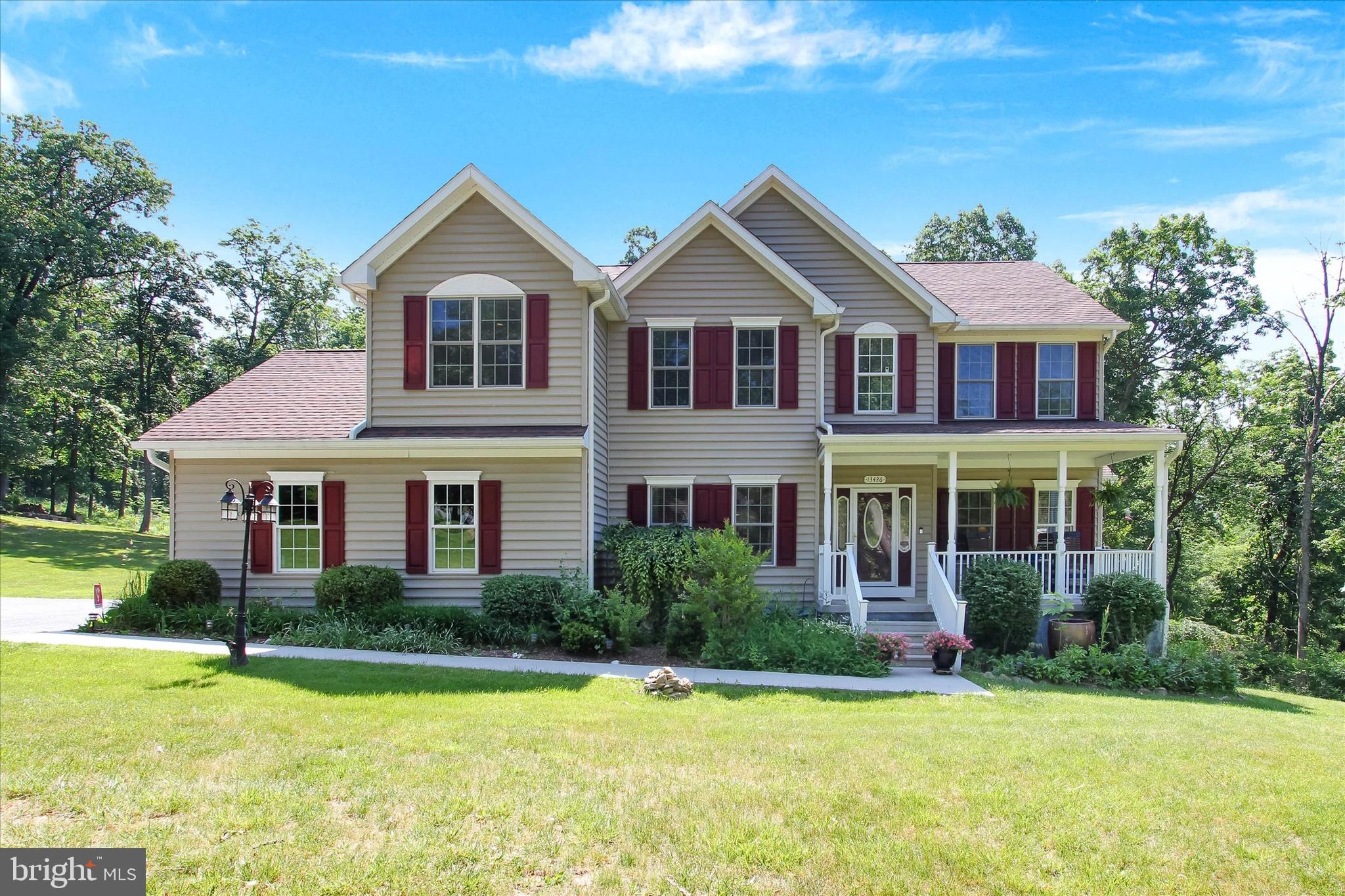 Welcome home to Blue Ridge Summit! If you are looking for a beautiful house/farmette with privacy on 7+ acres this is the home for you. It is tucked back yet close for commuting, shopping and recreation. This custom built home has an open family room with a pellet FP and kitchen that leads to the fantastic deck, a large dining room and a living room that could be used for a home office.  There are 4 bedrooms upstairs and laundry area on the second floor. The primary bedroom has plenty of room with a large walk in closet, sitting room and a bathroom with a shower, soaking tub and double vanity.  There is an unfinished basement with a walk out door to the fenced in back yard area and a plumbing rough in. You can bring your animals including horses, plant a large garden and enjoy nature. Part of the lot can be subdivided to build on; good for future plans. Make your appointment today!