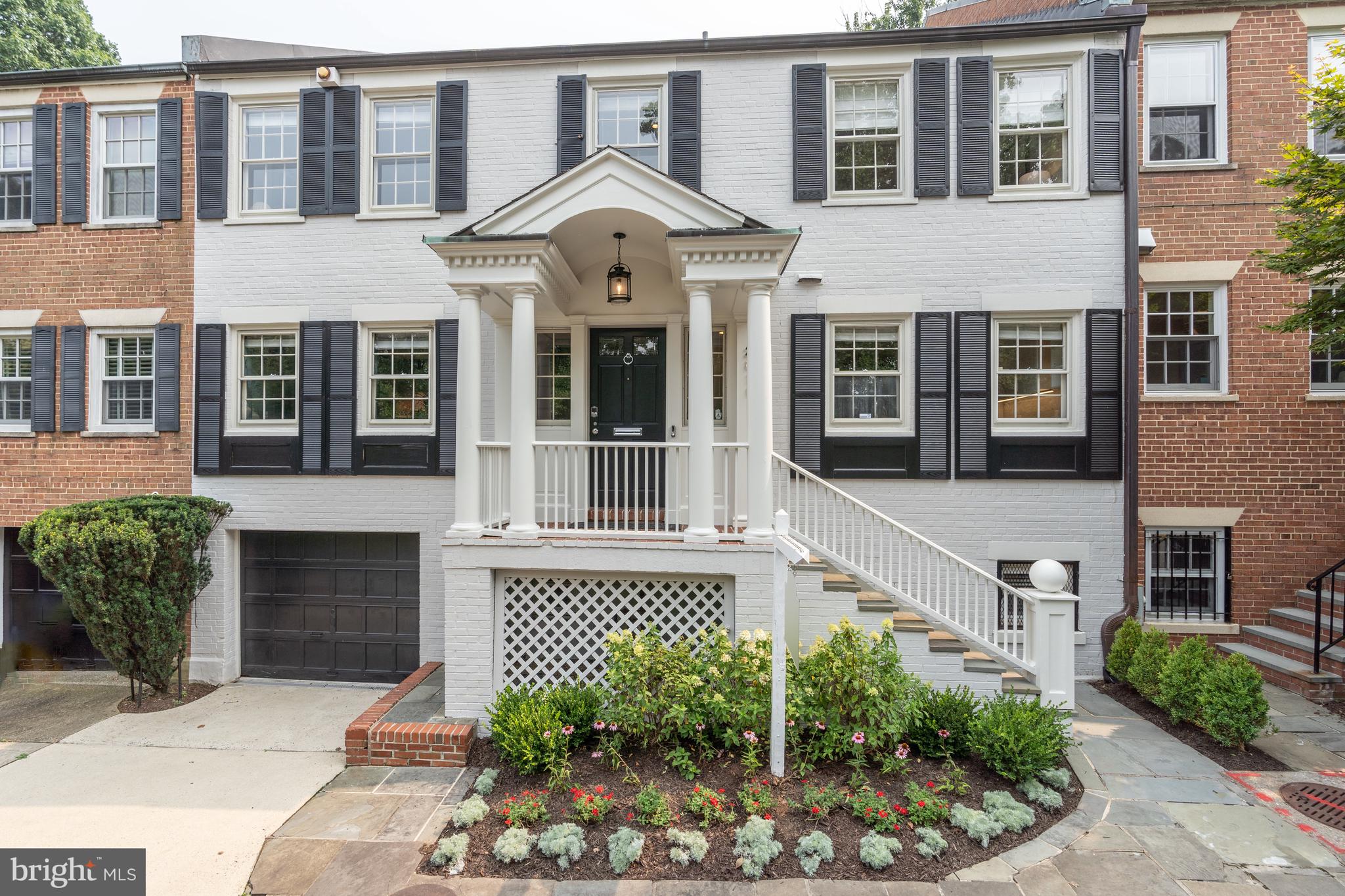 NEW LISTING! Fantastic Georgetown Colonial home freshly updated with recent renovations in prime East Village location. Offering 4 bedrooms, 3 bathrooms, 1 half bathroom and garage parking. The Main Level features a spacious open concept floorplan with an expansive Living Room, Office, Dining Room and Kitchen renovated by Checchi Homes in 2022. The spacious kitchen features top-of-the line stainless steel appliances, Quartz counters, marble tile backsplash and custom cabinetry. Oversized, south-facing windows line the entire length of the home allowing for an abundance of natural light at every turn. The Upper Level boasts a large Primary Suite, two generous Bedrooms and an updated Hall Bath. The Primary Suite features sizeable windows overlooking the quiet rear garden, a large walk-in closet with custom shelving, lavish spa-like bath boasting a large enclosed glass shower with marble tiling, large soaking tub, and double vanity with marble counters. The Lower Level of the residence features the fourth bedroom with an en-suite bathroom, large Rec Room with custom built-in shelving, new wood flooring and an updated wet bar renovated by Cecchi Homes in 2022. Completing this quintessential Georgetown home is the professionally landscaped garden with private, multi-level flagstone patio and grilling station in the rear of the home – the perfect spot for entertaining. All of this plus secure garage parking with direct access to the Lower Level.