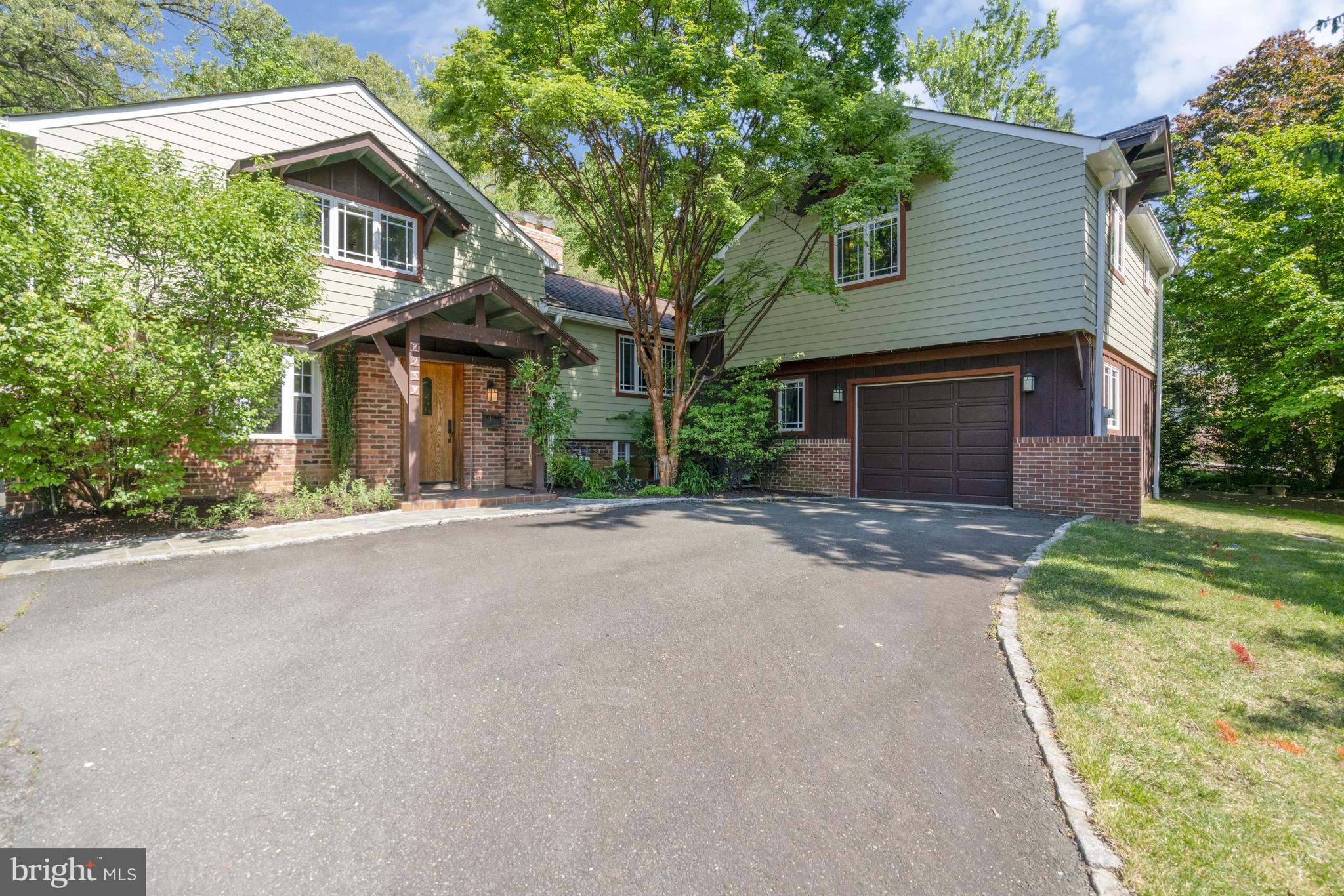 MAJOR PRICE ADJUSTMENT! ** Wonderfully unique home on .28 acre lot in North Arlington. This home has so much character and so many windows!!!  Don't miss the 3D tour! Four bedrooms, three full bathrooms.  North Arlington Schools and close in location. The original home was built in 1947; Designed by Arlington architect Kenton Hamaker, it features handcrafted knotty pine paneling, doors, and cabinetry found throughout the home. The oversized garage and gorgeous primary suite were added in 2000, with a Craftsman style blended with the original New England Revival design.  Original carriage house to the left completes the package with additional storage on ground level and a private home office with built ins and fantastic back yard views.  Huge chefs' kitchen with tons of cabinets, island, 2 sinks, granite, stainless appliances, professional grade gas range with vent hood, second oven, beverage cooler and eat in table space.  Formal dining room w/ built ins, huge living room with cathedral ceiling, wood beams, hardwoods and a wood burning fireplace.  Beautiful sunroom off the kitchen/dining rooms overlooking the stone patio and beautiful yard.  Main level also offers a bedroom and full bath as a perfect guest suite (pocket door to close it off).  2 additional upper-level bedrooms with tons of built ins (including a “ship style” bunk bed) and a full bath.  Storage/pantry/mud room off kitchen and a lower-level den completes the original home. Serene primary suite with hardwoods, 2 huge walk-in closets, cathedral ceiling w/ wood beams overlook the back yard flagstone patio and trees.   Primary bath includes soaking tub and separate shower.  Separate laundry room/mud room with walk out to back yard & easy access from garage.    Whole house & office wired for ethernet (2010), Hardywood siding (2013), Roof with 50-year shingles (2013), Upgraded lighting in kitchen & basement rec room, & new 10-yr smoke detectors (2021), Rebuilt both chimneys (2023), New hot water heater (2023), New dishwasher (2024). Plenty of driveway parking and a private, landscaped yard complete the package!