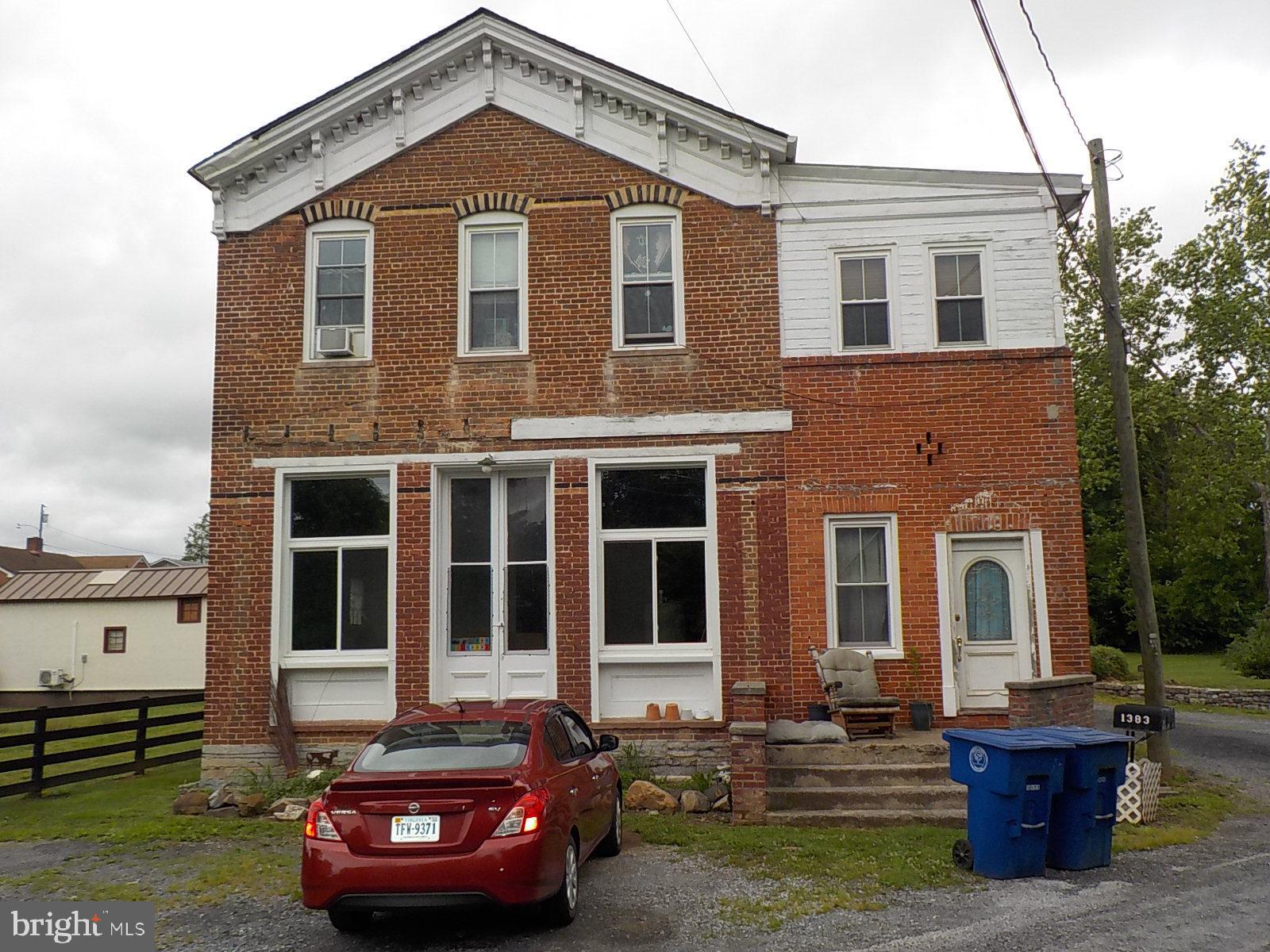 AGENTS THIS IS A FOR SALE BY OWNER PLEASE CALL THE OWNER FOR EVERYTHING:

The deed of this home states it was built in 1879, however pictures found in a museum has shown as early as 1869. This is a multi-family home with 2 apartments on the second level and living quarters on the main floor. Aside from the 2 apartments upstairs there is also a laundry room in a common area shared by all the tenants. There is also a landlord office just off the side of the laundry room. This is a brick structure and all the windows have been replaced with Simonton double hung low E argon. The roof was replaced in 2016 with 35 year architectural shingles. Both apartments and the main floor have been metered individually.  Approximately 1500 square feet of the main floor is in the rough and ready to be finished to your liking. There is a small basement with Bilco doors approximately 15' X 10' where the old coal furnace used to be. A crawl space can be accessed through an opening in the basement with an approximate 3' to 4' crawl space.
