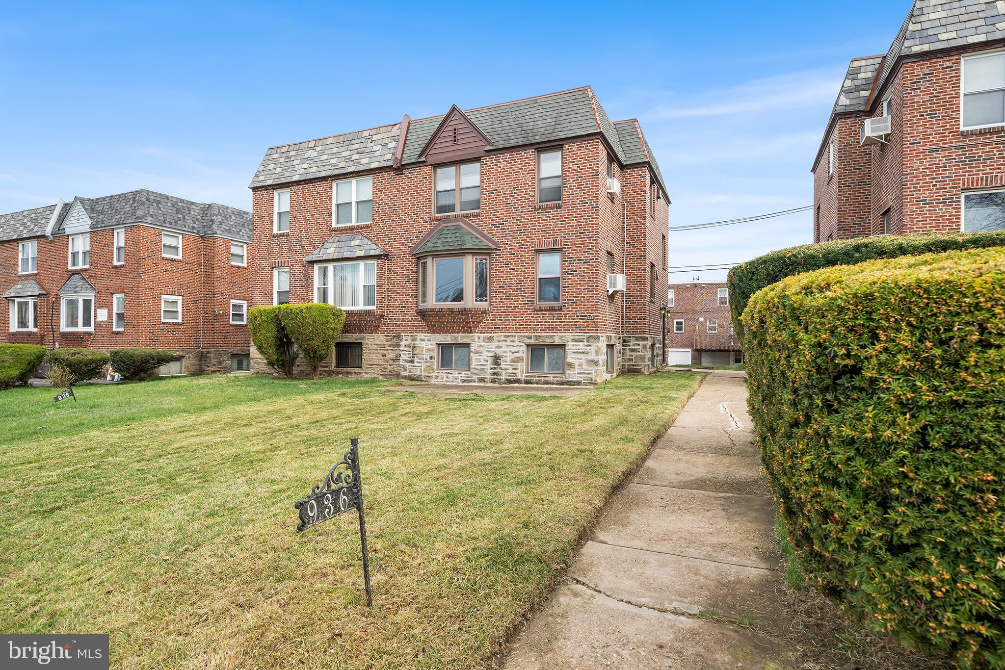 Highest and best offers due Tuesday April 8th at 11am. Welcome to 936 E Vernon Rd, a meticulously maintained twin duplex nestled in the heart of East Mount Airy. This solid brick and stone exterior duplex offers a fantastic investment opportunity or it can be  ideal  for an owner-occupant. Each unit features two bedrooms and one full bathroom,  along with a generous living room, a formal dining area, and an open-concept kitchen. These units offer plenty of natural light and lots of storage.  Both units have been freshly painted. The property features a 2-car garage and 2 car driveway. The 1st floor unit offers a private composite deck at the rear of the property, while also having a shared from patio. The lower level provides laundry, a powder room, and private storage lockers.