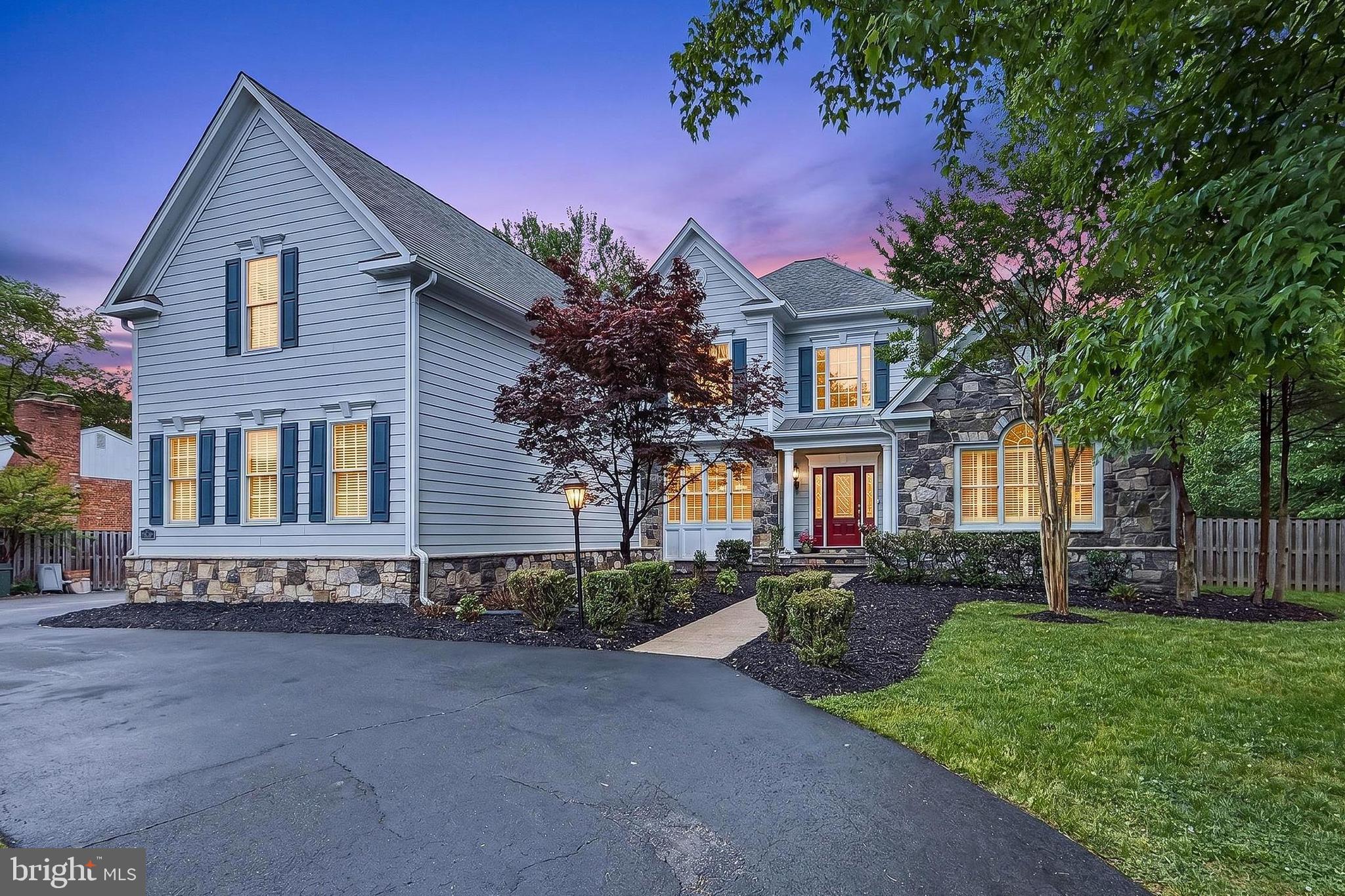 *** OFFER DEADLINE - MONDAY, 5/18 @ 5 PM *** Custom-built Vienna home offers 6,000 finished square feet of thoughtfully designed living space in the Madison High School pyramid. Built in 2007 with quality construction and a highly functional layout, the home is particularly well suited for multi-generational living, extended stays, a home business, or evolving household needs. Set on a private level .56-acre lot, it combines interior scale with a rare and usable outdoor setting. A stone and Hardiplank exterior, half-circle driveway, 2-car side-load garage, and extensive additional parking create a strong first impression and make hosting effortless. The backyard is level, fenced, and ideal for a future pool, with added functionality beneath the lawn to accommodate overflow parking during gatherings. ***** Inside, warm hardwood flooring, decorative moldings, 3 gas fireplaces, high ceilings, and an abundance of Pella windows including bay windows with Plantation shutters and skylights create instant appeal. The main level features a two-story foyer, formal living room and dining room, gourmet kitchen with breakfast room, a spacious family room, plus a private main level primary suite—a layout that balances openness with defined spaces designed for everyday living and entertaining. The gourmet kitchen is a chef’s delight with gleaming granite countertops, an abundance of custom 42” cabinetry, stainless steel appliances, center island, and walk-in pantry. The sun filled breakfast room with skylights and seated bar opens to the family room featuring a soaring vaulted ceiling with skylights and a cozy fireplace. Step out to the multi-area deck with steps to a large paver patio and lush backyard with shed dotted by majestic trees and surrounded by privacy fencing, perfect for outdoor gatherings and simple relaxation. A powder room and large laundry room round out the main living area. The main level primary suite provides your own private retreat boasting a deep tray ceiling with lighted ceiling fan, walls of windows, and two walk-in closets with custom organizers. The ensuite bath features a granite topped dual sink vanity, water closet, soaking tub and frameless glass enclosed shower. ***** Hardwood flooring continues upstairs where you’ll find three spacious bedrooms, a junior suite with private bath, and two additional bedrooms, each with walk-in closets, sharing access to custom a Jack and Jill bath with dual granite topped vanities. ***** The expansive walk-up lower level adds another layer of versatility featuring a huge multi-area recreation room with built-in bookcases, a Murphy bed that conveys, a wet bar, fireplace, and a 5th bedroom and 4th full bath. A large utility room with washer and dryer and huge unfinished area provide loads of storage space and potential to finish with your own design.  A private side entrance leads to a separate upper-level living space with vaulted ceilings, a bedroom, full bath, living area, kitchen and its own washer and dryer. This distinct space provides excellent flexibility for guests, extended family, or long-term stays while maintaining separation from the main home. ***** Extensive system upgrades and thoughtful construction details include a new roof and skylights (2023), upper HVAC (2021), new hot water heater (2025), updated kitchen appliances (2024 to 2025), and new LVP flooring in the lower level and private living space (2025). Built with 2x6 exterior walls, Icynene insulation, a four-zone HVAC system, central vacuum, and a whole-house generator supported by an 850-gallon propane tank, the home is designed for long-term comfort and efficiency. With three separate washer and dryer sets, multiple private living areas, and a layout that adapts to a variety of living arrangements, this home offers a rare level of flexibility, privacy, and space in a prime Vienna location.