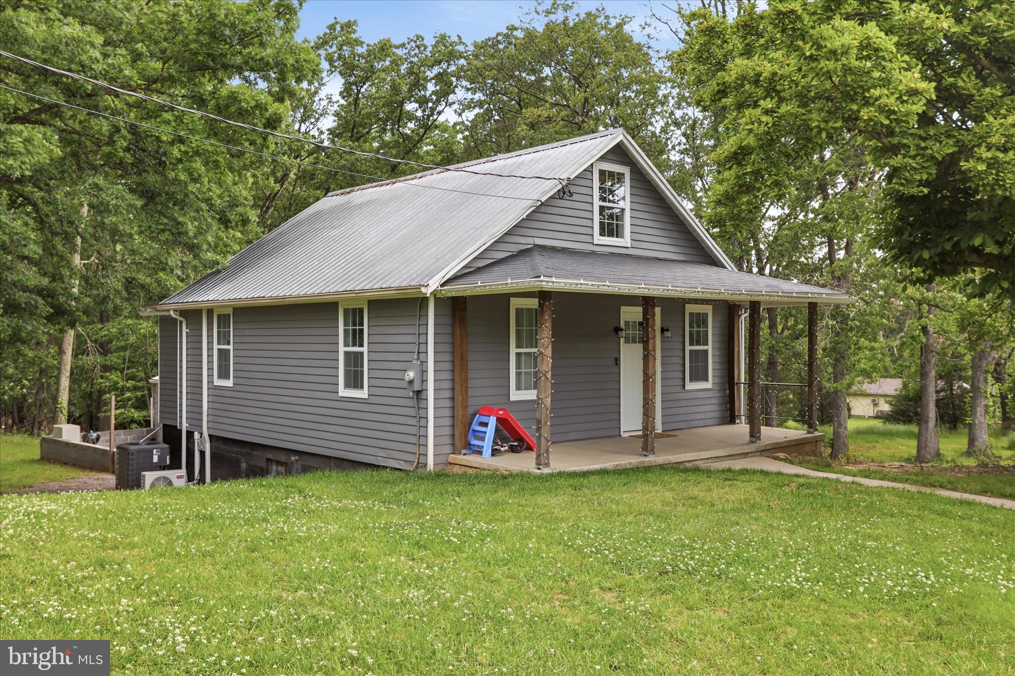 Very well done Cape Cod in Clear Spring, This home offers privacy, and woods. Updates include Kitchen, floors, exterior, interior finishes, roof, newer well and Septic and the list goes on.  Detached two car garage. Two bedrooms on main level with a full bath and a bedroom on upper floor serviced by a mini split for heat and A/C.  Clear Spring school district and quick access to I-70