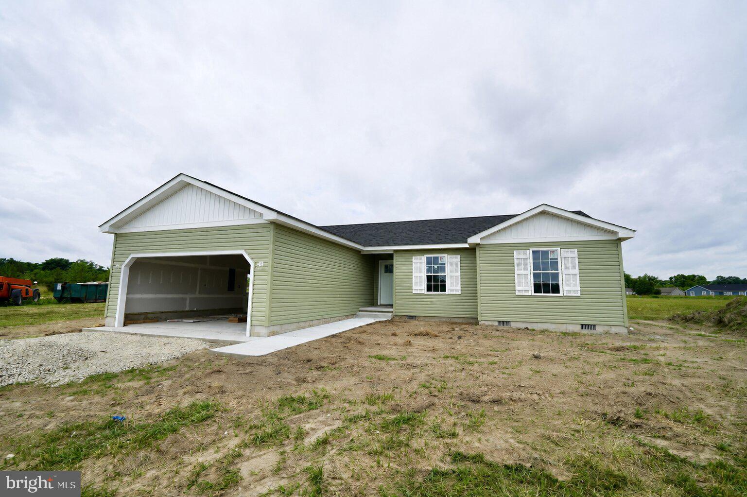 Welcome to your dream home – a brand new construction on a 1/2 acre lot with excellent privacy and peaceful farmland views. The local builder’s superior craftsmanship is evident throughout and far exceeds the quality of new construction homes from large national builders.

Step into the exquisite Memphis Model, thoughtfully designed for your well-lived lifestyle. Picture an open, airy space where the kitchen, dining area, and great room flow seamlessly together, creating a casual and comfortable environment perfect for every occasion. The inviting open-concept kitchen is an entertainer’s delight, making hosting effortless and enjoyable.

Experience the luxury of low-maintenance living with beautiful LVP flooring that offers both style and everyday practicality. Worried about the unknowns? Rest easy with the peace of mind of a Builder Backed Warranty, allowing you to fully enjoy your new home without concern.

Nestled on a true gem of a home-site with beautiful farmland views, this property is an unparalleled opportunity to make your dream home a reality. This new construction home will be fully finished and move-in ready in under 45 days.