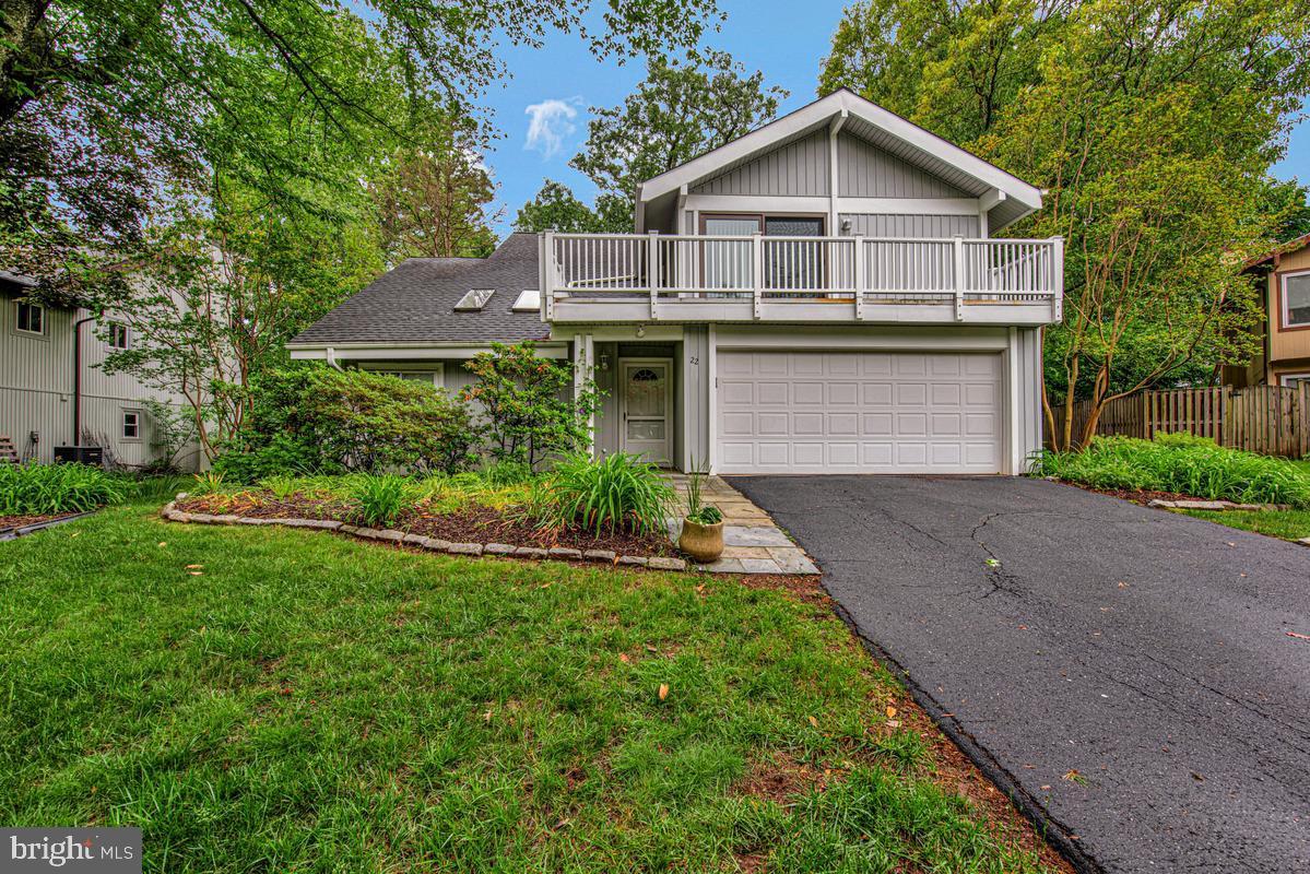 Nestled on a serene cul-de-sac graced with mature trees, this stunning detached contemporary colonial presents an extraordinary opportunity for the discerning buyer. A welcoming two-car garage and timeless curb appeal set the tone for what awaits within. The sun-drenched main level impresses with soaring vaulted ceilings in the expansive living room, where skylights bathe every corner in natural light. Effortless entertaining flows from the informal dining room into the warm and inviting family room, anchored by a classic wood-burning fireplace. The well-appointed kitchen offers an abundance of cabinetry, updated appliances, and a charming breakfast nook — perfect for morning rituals. A convenient powder room and dedicated laundry off the garage complete the main level with thoughtful practicality. Ascend to the upper level, where the luxurious primary suite awaits — featuring vaulted ceilings, a private balcony, a generous walk-in closet, and a spa-inspired ensuite with an enclosed shower. Three additional bedrooms, a full bath, and a versatile loft provide ample space for every lifestyle. Ideally positioned minutes from premier shopping, dining, entertainment, and major commuter routes. Opportunities like this are rare — schedule your private showing today.
