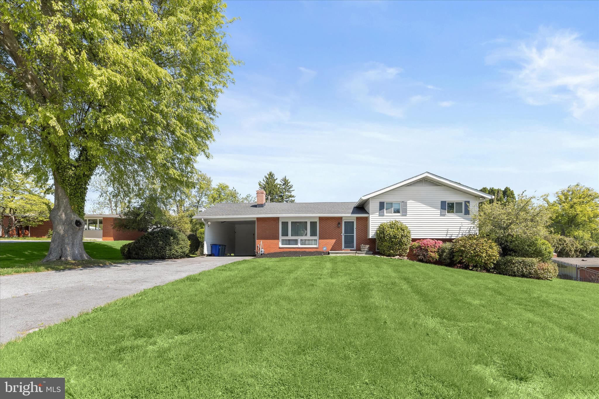 Tucked away on a quiet street in sought-after Stevenson, this five bedroom, two full and one half bathroom home sits on a pristine half-acre lot and offers a seamless blend of comfort, updates, and inviting outdoor living, along with flexible interior spaces that easily adapt to everyday living, entertaining, or working from home. Inside, a redesigned open floor plan is enhanced by a neutral color palette, vaulted ceilings, and rich hardwood floors that flow through the spacious living and dining rooms. Large sliding glass doors in the dining area open to a deck with a retractable awning, creating an easy transition to the peaceful backyard setting. The renovated kitchen is both stylish and functional, featuring quartz countertops, a subway tile backsplash, 42-inch soft-close cabinetry with under-cabinet lighting and pull-out shelving, a farmhouse sink, and a breakfast peninsula for casual dining. Stainless steel appliances include a refrigerator/freezer, beverage and wine fridge, built-in microwave, dishwasher, and a gas range with double ovens and a range hood. The primary suite serves as a private retreat with a thoughtfully designed bathroom addition, complete with a frameless glass walk-in shower with dual shower heads, heated tile floors, a dual sink vanity, and a towel warmer.  A spacious walk-in closet and custom wardrobes complete the suite. Two additional bedrooms and a full bathroom are also located on the upper level. The lower level offers a comfortable family room with custom built-ins, a gas fireplace, and access to a covered patio, along with a fourth bedroom, half bathroom, and laundry room. An additional level provides a flexible recreation space, fifth bedroom, and extensive storage, including a utility room and a rare fallout shelter. Step outside to your own private outdoor oasis, with space for dining on the deck, relaxing on the covered patio, playing in the expansive yard, or enjoying the heated saltwater pool with an energy-efficient automated heating system. All of this in a super convenient Stevenson location, just minutes from 695 and 83, and close to shopping, dining, and everything the area has to offer.