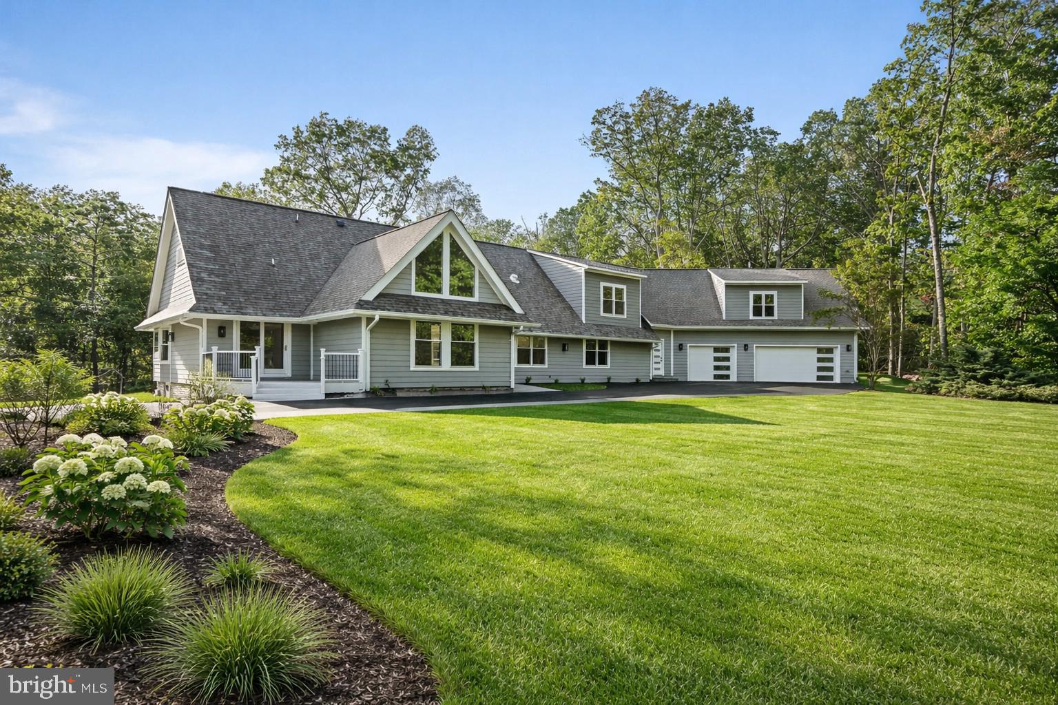 Now offered at a newly introduced spring price of $2,149,900! This fully remodeled Modern Ranch at 10900 Hunter Station Rd on almost 2 acres showcases sophisticated design and exceptional craftsmanship. The home has just undergone a remarkable transformation that includes huge addition with 3 car garage, meticulously renovated to create a perfect blend of modern luxury and elegance. Spanning 3 beautifully designed floors, this nearly 7,400 square foot Vienna home offers 4 bedrooms, 3 bonus rooms and 7 full bathrooms. With those attributes alone, it’s already a highly sought-after residence, but its distinctive designer features truly elevate it to a league of its own including a sophisticated eat-in kitchen and a huge primary bedroom suite with customized walk-in closet. State of the art 3 car garage offers high end flooring with all recessed lighting and car charger. Harwood floors throughout the upper two levels with and all custom closets. Behind-the-scenes upgrades include all updated systems, laundry area with washer and dryer units and two master bathrooms with free standing tubs. Please find floor plans in the documents section of the listing. Experience modern living at its finest in this exquisite Vienna residence. Great location 1.5 miles from the W&OD, nearby access to a number of greenway trails and streams. The trail network connects to the CCT. 4 miles from the Vienna Metro/Orange line, just 9 miles to Dulles International Airport. Close proximity between downtown Vienna and Reston Town Center. ***Some photos have been virtually staged to illustrate the potential use of space. ***