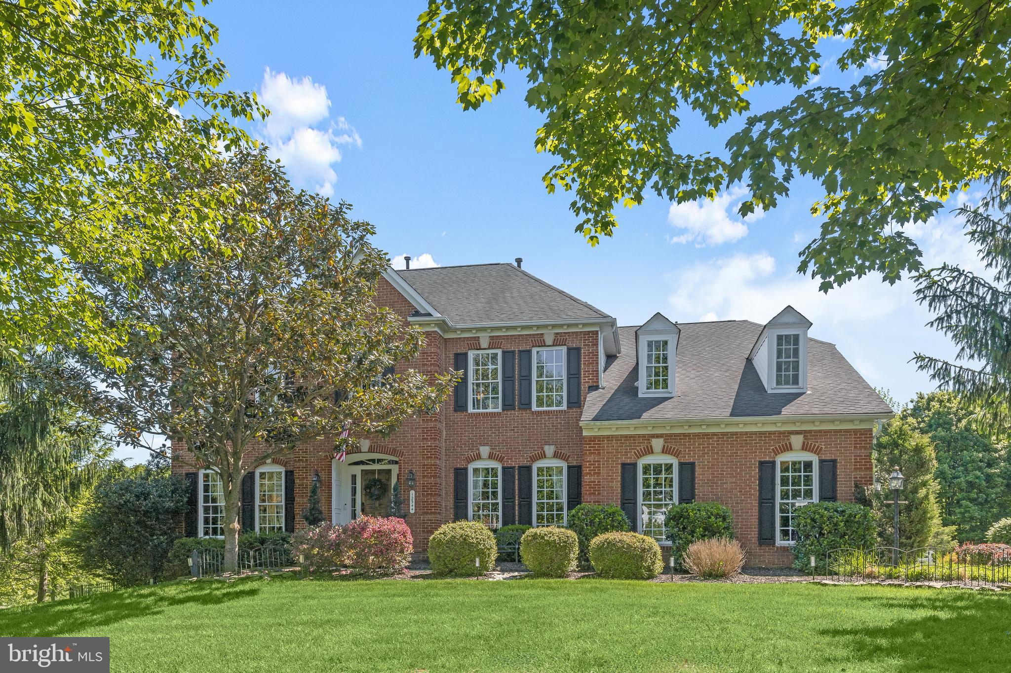 Welcome to 12344 Fox Meadow Lane, an extraordinary residence gracefully set on nearly one acre in one of Howard County’s most coveted communities. Showcasing exceptional updates throughout, this remarkable home masterfully blends timeless elegance with luxurious designer finishes and resort-style outdoor living. An incredible backyard oasis awaits with a 28,000-gallon saltwater pool and spa, putting green, outdoor fireplace, and expansive entertaining spaces designed for unforgettable gatherings and everyday relaxation.
Inside, oversized windows flood the home with natural light, highlighting soaring ceilings, rich hardwood floors, and exquisite moldings that add warmth and sophistication throughout. A grand foyer is flanked by formal living and dining rooms, creating an elegant setting for entertaining, while French doors from the living room open to a private executive office.
At the heart of the home, the gourmet eat-in kitchen is beautifully appointed with quartz and granite countertops, a large center island with breakfast bar, double wall ovens, decorative backsplash, apron-front sink, glass-front pantry, and an impressive beverage center complete with display cabinetry and a planning station. The adjoining morning room features vaulted ceilings with exposed beams and opens seamlessly to the expansive deck and outdoor living areas. Just beyond, the stunning two-story great room is anchored by a stone fireplace and offers breathtaking views of the outdoor oasis. A powder room, mud room with a dog-station, and garage access complete the main level.
Upstairs, the luxurious primary suite serves as a private retreat, featuring a beautifully renovated spa-inspired bath with dual vanities, a slipper tub, glass-enclosed shower, and a spacious walk-in closet. Bedroom two offers a private en-suite bath, while bedrooms three and four share a dual-entry full bath. This level also includes a potential fifth bedroom, convenient laundry room, and attic storage.
The walkout lower level expands the home’s impressive living space with oversized windows that fill the area with natural light. Designed for both entertaining and recreation, this level features a spacious game room with a dry bar, exercise room, full bath, and sixth bedroom, all with direct access to the pool, putting green, and outdoor retreat beyond.