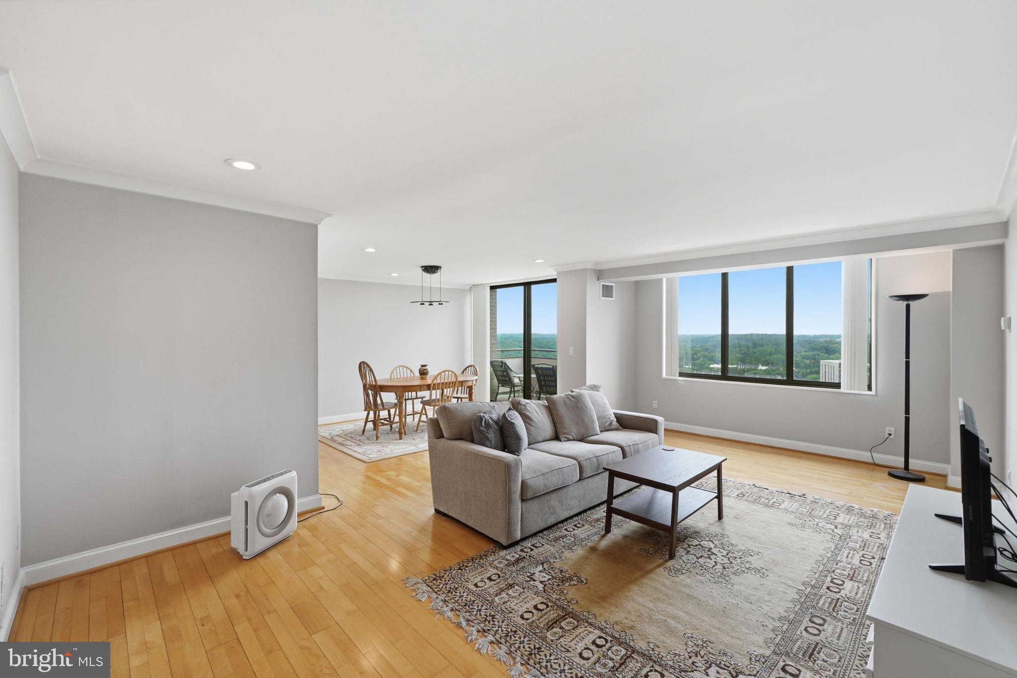 Welcome to Apartment 1819N....a penthouse unit in the
renowned Promenade Coop on Pooks Hill Rd. in
Bethesda. This apartment is unusual in that it has a
smooth ceiling throughout with recessed lighting, and a
magnificent view of the outdoor swimming pool and the
panoramic view beyond. The floors are Oak plank wood.
The apartment has lots of storage including two large
walk-in closets. The table space kitchen has the floor and
backsplash done in the same tile. The counter is stone.
There is a pantry and lots of cabinets. The dining room
and foyer have contemporary chandeliers. The large
balcony is off the dining room. The bathroom is tiled
throughout. It has a walk-in shower with a tiled bench.
The windows are oversized offering a wall of windows in
the living room. The building has so many amenities, it lives like a resort. The lobby is in the process of a
complete renovation. The recently redecorated Arcade level has the state of the art fitness
center with indoor pool and hot tub: locker rooms with showers and sauna. Also in the Arcade
is Chef Tony’s restaurant (a well known seafood/Italian eatery), a grocery store/deli, dry
cleaners, travel agent, beauty salon, resident lounge, party and conference rooms. There is a
large outdoor pool with adjacent grills. Tennis (lighted courts) and pickelball have their own
building as you drive onto the property. Ping pong is played regularly, as are social activities
such as “Breakfast at Wimbleton”. There are too many activities to mention them all. A few
are …trivia night, open mike night, monthly first fun movies, lectures, vaccinations, vote in all
elections in the party room (including Presidential). There is meditation, exercise class, book
club, canasta, bridge, and mahjong. We have wine and cheese get togethers in the lobby, a
rocking New Year’s Eve party and various other celebrations. We have car charging stations,
and a car washing area with a dynamite vacuum. Garage parking comes with the unit. It is
easy to get to the Red Line Medical Center metro stop at NIH/Walter Reed. The bus comes to
the door of the Promenade. Close to 495 and 270. Nearby Wildwood Shopping Center has
Balduccis, CVS, Bethesda Bagels, Starbucks, a number of places to eat and several cute
boutiques. Giant food is just across the street.
