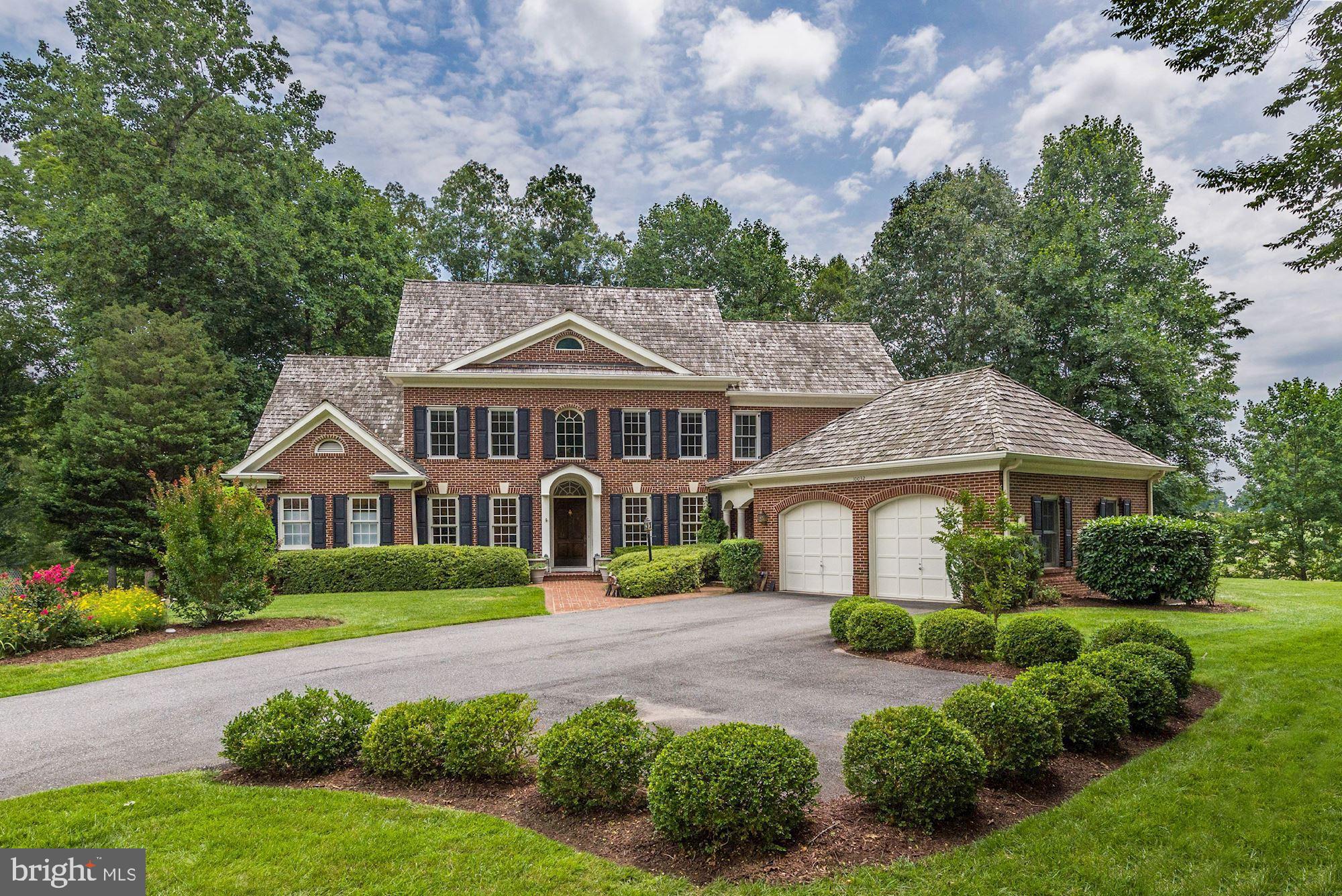 Sited on over half an acre on a cul-de-sac and backing to the 6th green, 7th tee & a lake, this residence offers wonderful golf course views and private setting!  Wonderful features throughout include updated open first floor floor plan, expanded 1st and lower level, updated bathrooms on main and upper levels.  The main level features a two story foyer, gourmet kitchen with large island and Viking range, living room with fireplace, dining room, formal sitting area, 2 half baths, a separate laundry room, mud room, and rear covered patio.  Upstairs features a second master suite, 2 additional bedrooms and one bath, and a beautiful covered porch overlooking the rear yard.  The lower level features a large family room with fireplace and patio, bedroom with full bath, rec room, and media room.  The property is completed by an attached 2 car garage.