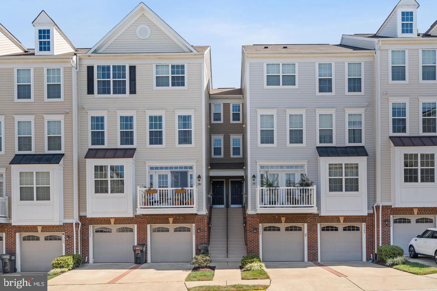 Welcome home to this light filled townhouse which is located on one of the best areas in the neighborhood, backing to calming and peacefully open spaces and trees. This home is located in the sought-after area of Sterling, VA, and in PFHS district this well-maintained home spans four levels and features over 2,100 square feet of modern living space. This home features 2 full baths and 2 half baths perfect for entertaining, this home has it all. The property features a spacious, open-concept kitchen equipped with granite countertops and stainless steel appliances, seamlessly flowing into a light-filled living area. The top-level primary suite offers a private retreat with a spacious walk-in closet and an en-suite bathroom. A fully finished basement with stunning soaring 13-foot ceilings provides an flexible space, perfect for entertaining or a home office. The walkout lower level with sliding glass door with an oversized family room with a half bath and garage access. Additional features include a spacious garage with ample parking and easy access to major routes like Route 7, Route 28,Reston Metro and Dulles Airport. Enjoy proximity to Claude Moore Park’s trails and community amenities such as a pool, lawn care, and water, all covered by the HOA.
