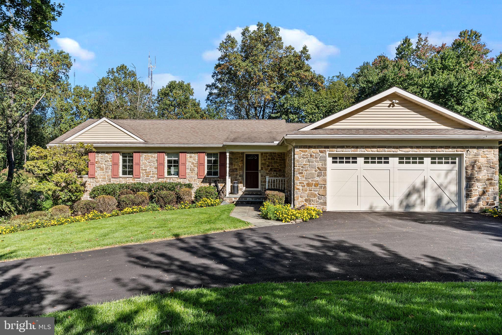 OPEN HOUSE SCHEDULED FOR 11/12 IS CANCELED.

 Introducing 449 Hidden River Road! A stunning stone-front, move-in ready, ranch style home nestled in a private and desirable Penn Valley neighborhood. This meticulously maintained home underwent a total renovation in 2009 and offers first floor living with a perfect combination of modern upgrades and timeless charm. This home features three bedrooms, with a potential fourth, three full bathrooms, oversized two car garage, and over 2,600 square feet of living space on just under an acre lot. Not included in the square footage is a massive flex space awaiting your personal touch. The endless amount of possibilities here makes this home a must see!

Step inside to a large entry way and you’ll be greeted with an abundance of charm from the crown molding and hardwood floors that flow seamlessly throughout the entire residence. The main living room features a vaulted ceiling and custom built in cabinetry with switch operated gas fireplace, creating a cozy ambiance for gatherings. Overlooking the living room is the gourmet eat-in kitchen with granite countertops, rollout cabinetry throughout, WOLF stovetop, and built-in paneled dishwasher and Sub-Zero Refrigerator. This space makes entertaining a breeze with it's easy access to indoor and outdoor dining spaces. The kitchen offers direct access to a lovely deck where you can enjoy the peaceful views of your wooded lot, and entertain for summer BBQs. A pocket door separates the kitchen from the formal dining room that features antique built ins and tray ceiling. Completing the right wing of the home is a pantry and interior access to the oversized two car garage with additional space for a workstation. 

The left wing of the main level consists of two bedrooms, two full bathrooms, and a laundry room with wash basin. The large primary suite, with tray ceilings, includes a walk-in closet and spacious bathroom offering a glass enclosed shower with bench seating and an oversized single vanity with plumbing capabilities for dual sinks.  An additional room on this level is currently being used as a sitting area, but would make a great office with the addition of French doors, or can be easily converted to a fourth bedroom.

The lower level makes this a truly unique and versatile home. When you reach the bottom of the steps you will be greeted by a family room showcasing a full brick wall that houses a wood burning fireplace, and plenty of natural light from the dual walkout doors leading to a covered patio. Continuing through the lower level you will find a bedroom, a full bathroom, and multiple closets allowing the potential for an in-law or au pair suite. An unfinished room, with plumbing, could be converted into a full kitchen making this space a true in- law suite. The lower level also provides access to the former oversized 2 car garage that has been insulated and is currently used as unfinished storage space. With exterior entry, the possibilities here are endless with an estimated 500+ square feet of flex space. Some ideas include an extended in-law suite, game room, future pool house, home gym, or even a space for your dream golf simulator! Finishing off the lower level is a walk in cedar closet and unfinished space that houses the upgraded utilities and provides plenty of storage. 

Notable upgrades include PEX plumbing throughout, whole-house generator (2021), new water heater (2023), roof replacement (approximately 2010), HVAC Updating (2021) and gutter guards with a transferable warranty (2021). A brand new driveway (2023), provides ample parking and curb appeal for this home set on a generous .92-acre lot.

Conveniently located in Penn Valley, this home offers easy access to prestigious schools, upscale shopping, and an array of dining options. With its prime location and exceptional features, 449 Hidden River Road presents a rare opportunity to own a truly remarkable residence.