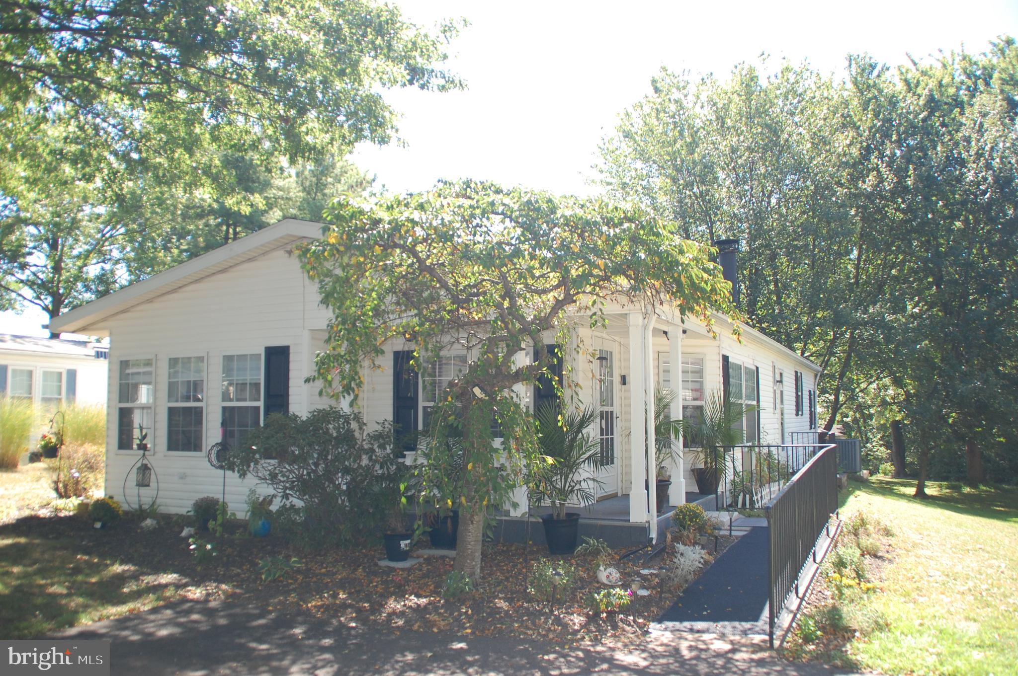 Here’s a Hidden Springs home you won’t want to miss!  Professionally painted throughout, including ceilings, walls, doors and trim, using on-point colors in 2022.  Beautiful, newer LVP flooring in the LR, DR, Kitchen and hallway.  New roof 8/23, new air conditioning compressor (A/C outside unit) 4/22, and new water heater 7/24.  You will love the cathedral ceilings and crown molding found throughout this Sun Manor home, arguably the most popular model in Hidden Springs. The Foyer with coat closet adds comfort and convenience. The overall dimensions of the Kitchen and Breakfast Room are 20’ x 13’ with lots of cabinets and counter space for the resident chef! There’s a corner cabinet in the Breakfast Room that houses speaker wires that power speakers in the LR and Primary BR ceilings. The DR offers a built-in hutch and sliding glass doors to the 16’ x 10’ deck. This home has great closet space and plus a storage shed outside. Speaking of the outside, you will enjoy relaxing on the patio nestled behind the house overlooking an expanse of grass and into wooded open space.  Patio furniture included!  This home is only one house away from being on the outer rim of the community and is steps away from the walking path that winds its way along a portion of the outer rim.  Pictures were taken in August, 2025.  Home inspection reports available upon request.  There are lots of reasons why people love this award-winning community. Come see for yourself!  Don’t miss your opportunity to own this fine home.  Schedule your appointment today!