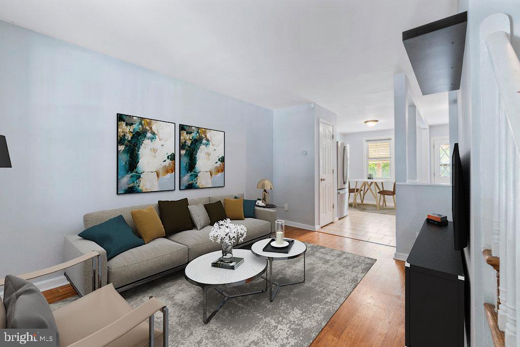 Welcome to 3322 Paine Street, a charming, move-in ready townhome tucked away in the heart of one of Baltimore's most sought-after neighborhoods—Hampden! Just moments from The Avenue, you'll enjoy easy access to some of the city's best local restaurants, coffee shops, boutiques, breweries, and year-round community events, all while coming home to a quiet residential street.

This delightful home offers 2 bedrooms and 1 full bathroom, blending classic Baltimore charm with thoughtful updates. Step onto the inviting covered front porch, the perfect place to enjoy your morning coffee or unwind after a long day. Inside, you'll find beautiful hardwood floors throughout, creating a warm and cohesive feel from room to room. The spacious living and dining areas provide plenty of room to relax or entertain guests.

The eat-in kitchen features stainless steel appliances, ample cabinet space, and room for casual dining, making it both functional and welcoming. Upstairs, two comfortable bedrooms offer great natural light and generous closet space. The full bathroom is highlighted by a skylight, filling the space with an abundance of natural sunlight and creating a bright, airy atmosphere.

Additional updates include a brand-new HVAC system, giving you peace of mind and year-round comfort. The unfinished basement provides endless possibilities—whether you need additional storage, a home gym, workshop, or envision finishing the space to suit your needs, it's a true blank slate waiting for your personal touch.

Step outside to the rear concrete patio, an ideal space for grilling, entertaining, container gardening, or simply enjoying the outdoors. Parking is made easy with access from the rear alley as well as convenient street parking out front.

Whether you're searching for your first home, downsizing, or looking for a low-maintenance property in an unbeatable location, 3322 Paine Street offers the perfect combination of charm, comfort, and convenience. Don't miss this opportunity to own a wonderful home just steps from everything that makes Hampden one of Baltimore's most beloved neighborhoods!