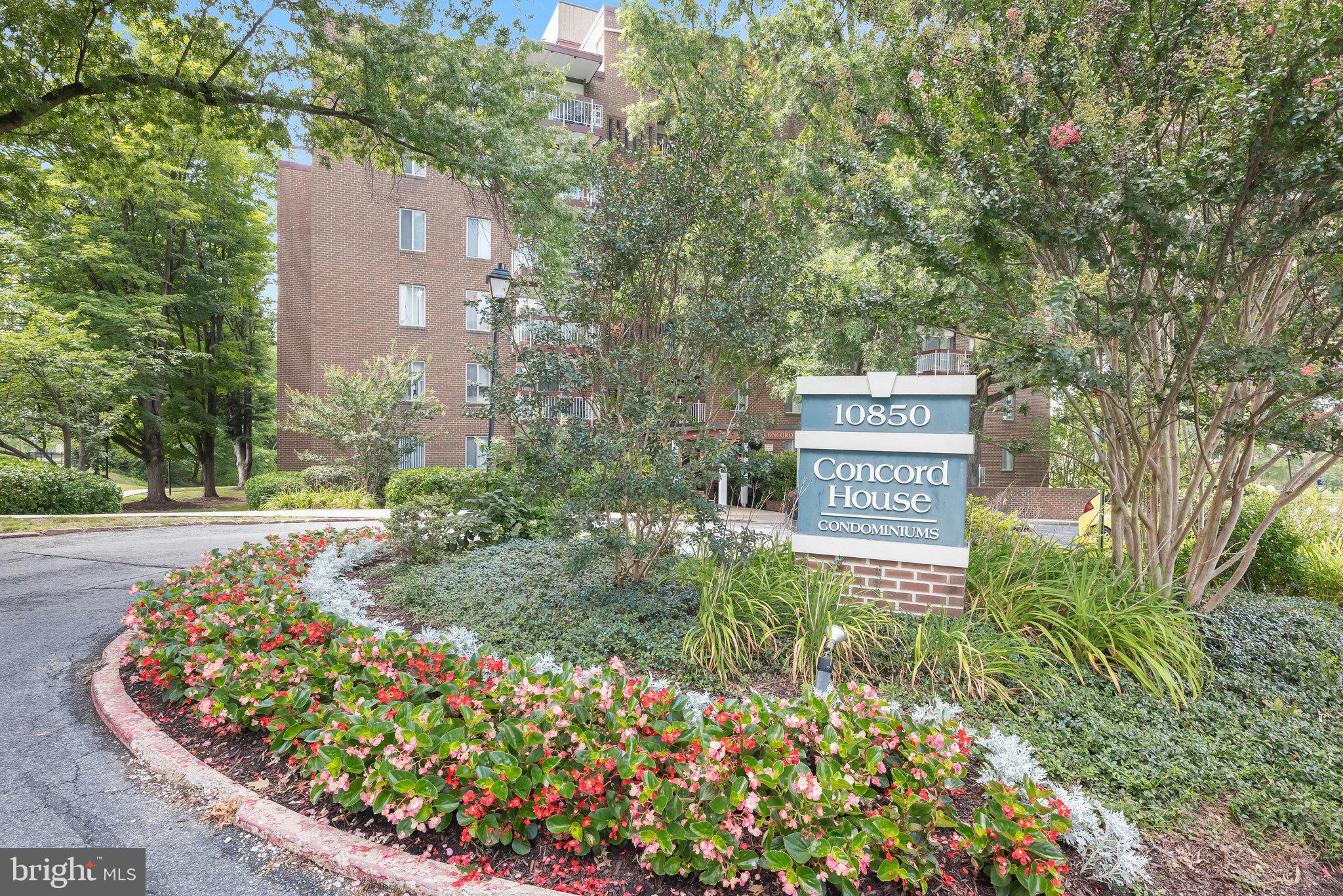 Welcome to this spacious condominium offering comfortable one-level living in a secure elevator building in the heart of Columbia's vibrant community. Filled with natural light, the open-concept floor plan features inviting living and dining areas enhanced by a soothing neutral color palette and a stylish new wall-mounted electric fireplace with a modern slatted wood surround, creating a warm and contemporary focal point.  Sliding glass doors lead to a private deck overlooking a peaceful tree-lined setting, an ideal spot to enjoy your morning coffee or unwind at the end of the day. The well-appointed kitchen features granite countertops, stainless steel appliances, and a new gas stove, offering both style and functionality.  The generously sized bedroom includes a walk-in closet and is complemented by a full bathroom, providing comfortable everyday living. Enjoy the convenience of elevator access, low-maintenance living, and an ideal location just minutes from major commuter routes, as well as Columbia's exceptional shopping, dining, parks, and entertainment. This home offers the perfect combination of comfort, convenience, and lifestyle.