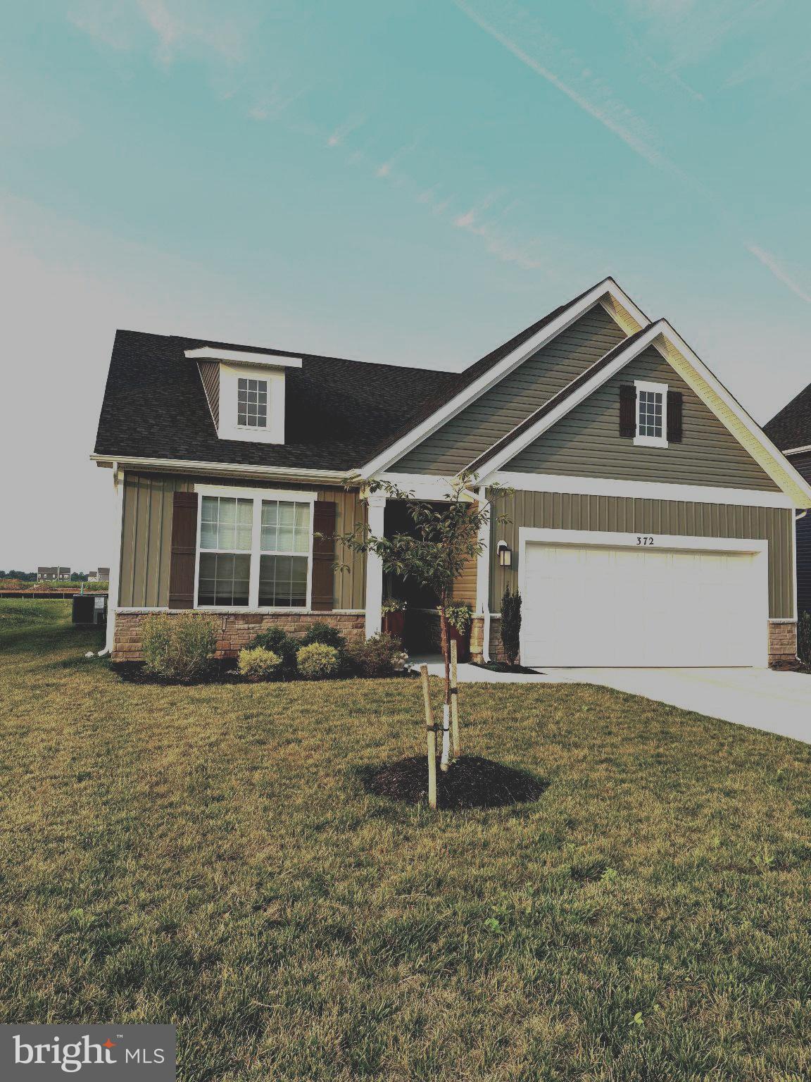 Welcome to your new home! This cottage-inspired two story has two master suites one on each floor!  The well though out main floor has an open-floor plan that is designed for modern day living. The family room, kitchen, and dining area all have luxury vinyl plank flooring and are all connected into one open space and the 9 ft ceilings add a feeling of spaciousness. The kitchen has quartz countertops that include a large island. The white kitchen cabinets are self-closing and taller than standard length. The appliances and deep island sink are all stainless steel. The dining area leads out onto a concrete 14 x 10 ft covered patio that has a view of the mountains. The carpeted master suite is conveniently located near the main living area. The master connects to a spacious bathroom with a quartz countertop, double sinks, vinyl plank flooring and ample storage. There is a private toilet and a walk-in tiled shower with glass doors. Beyond the bathroom is a large walk-in closet that also is connected to a laundry room for convenience. The main level also has two other carpeted bedrooms that share a full bath between them. The second floor has over 600 square feet of plush carpeting and provides a flex space that can be used for whatever your needs may be. Modern conveniences of this house is WiFi enabled garage door openers, Smart Home technology, keyless entry with deadbolt, video doorbell, and smart light switches. This home includes curtains, window shades and hardware and towel bars in the bathrooms. This home is move-in ready and waiting for you to call it home.