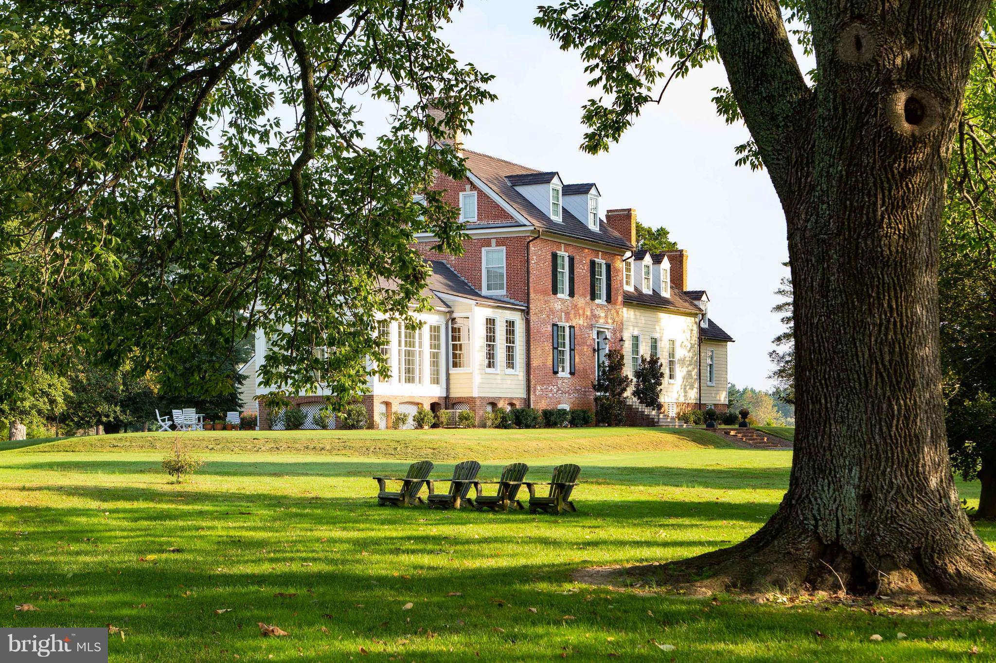 Located on the still waters of Town Creek in Oxford, Plimhimmon represents two distinct building periods dating from the late 18th and late 19th centuries, the oldest section being erected around 1767.  A true gentleman's farm, the current owners of this two-story home have set the standard for a historic restoration with painstaking detail in restoring the Georgian and Federal features.  Incorporating old-world craftsmanship, the manor has been brought to modern standards with such improvements as geothermal heating and cooling, elevator service from the basement through the second floor, and amenities expected of the waterfront estate market.  Sure to please the discerning buyer, Plimhimmon is one of a kind and an irreplaceable cornerstone of Talbot County's History. Quietly sited on 200 acres at the head of Town Creek, the farm has a dock with approximately four feet of water at mean low tide.  Statement trees and an appropriate blend of native landscaping and agriculture set the stage for country living.  A waterside guest cottage is situated nearby, offering those amenities for extended family and service help if needed.  An apartment over the garage, a carriage house renovated to provide studio/office accommodations, and a generously proportioned barn compliment the farm providing adequate facilities for the hobby enthusiast and outdoorsman alike. Wildlife and waterfowl abound among this historic staging area.  Long respected for migratory waterfowl, this area is known for epic numbers of migrating Canada geese, and the natural shorelines provide extensive habitat for shorebirds and ducks.  Shoreline buffers and restored wetlands provide a haven for many upland game species, as well as a fifty-acre wooded parcel offering a host of opportunities for the naturalist. Located just outside of Oxford, Plimhimmon is twelve miles from Easton / Newnam Field, providing jet service and facilities adequate for private aviation.  BWI is within an hour and a half, as well as Reagan National putting this farm within reach of the commuter and offering ease of access as a weekend retreat.
