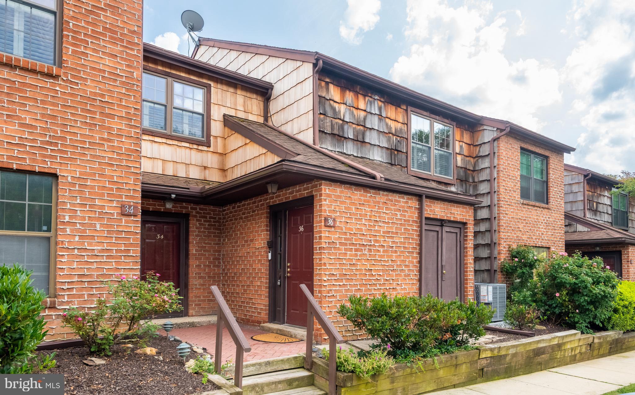 Welcome to 36 Witherspoon Court, a bright and spacious second-floor, two-bedroom condominium with a den offering pleasant views in the highly sought-after Embassy Court community of Chesterbrook. This is a terrific opportunity to own your own home in the top-ranked Tredyffrin–Easttown School District. The tiled entry foyer features a staircase leading to the home and opens to a sun-filled living room and dining area, featuring beautiful hardwood floors throughout the main living spaces. The living room includes a wood-burning fireplace with Colonial mantle, creating a warm and inviting focal point. Two sets of sliding glass doors open to the covered rear deck. The centrally located kitchen features raised-panel cabinetry, plenty of counter space, a new dishwasher, and a convenient pass-through overlooking the dining area. The spacious owner’s suite offers a walk-in closet with custom-built shelving and an en suite bathroom with a tiled shower and updated vanity. A perfectly situated dressing area with its own vanity is located just outside the walk-in closet. The second spacious bedroom features a large double closet and is served by a full hall bathroom. A tremendous bonus feature of this home is the den, a flexible space ideal for a home office, media room, or guest bedroom. A full-size laundry/utility room completes the interior. Enjoy the peaceful setting from the private rear balcony, the perfect spot for relaxing and taking in the views. Additional storage is available with the outdoor closet. Ideally located close to the Chesterbrook and Gateway Shopping Centers, the King of Prussia Town Center, Wilson Farm Park, and Valley Forge National Historical Park, as well as the shopping, dining, and train stations of the Main Line—all within the highly ranked Tredyffrin–Easttown School District. This is a wonderful opportunity to own a well-maintained home with an open floor plan in a prime Chesterbrook location.