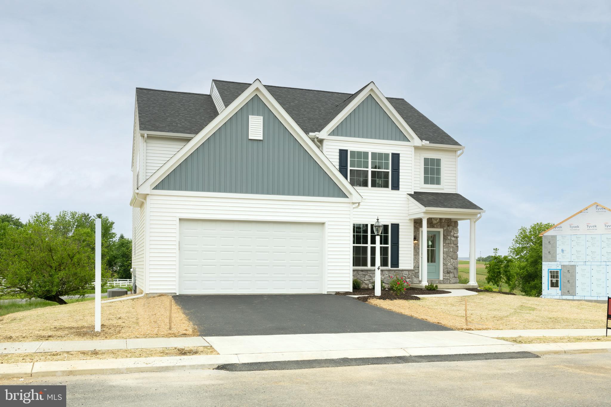 Are you ready to find your dream home? Look no further! EGStoltzfus proudly presents an exquisite model home, perfectly nestled amidst picturesque farmland in an ideal location. This stunning property offers everything you could possibly desire and more.

As you approach the home, you'll be welcomed by a charming covered porch that leads into a warm and inviting foyer. To your left, you'll find a delightful dining room, complete with elegant Craftsman wainscot trim. The first floor is a sight to behold, featuring soaring nine-foot ceilings that create an open and airy atmosphere with a refreshing beach vibe. The living room is the perfect place to relax and unwind, with a cozy fireplace and dry stack stone to the ceiling that you can enjoy all year round.

The kitchen is a chef's paradise, boasting the EGStoltzfus Homes Entertainer Package. You'll love the chimney hood vented to the outside, the sleek quartz countertops, and the stunning Harbor Grey glass tile backsplash. This space is designed to impress and is perfect for creating culinary masterpieces.

The owner's bedroom is a true sanctuary, featuring a grand two-door entrance and a luxurious retreat bath. Indulge in the quartz tile shower and the free-standing tub, creating a spa-like experience in the comfort of your own home. The cathedral ceiling adds a touch of grandeur, making this space truly exceptional.

The full walkout basement offers additional living space and leads to a breathtaking view of the farm behind the house. Imagine spending your evenings on the synthetic deck with vinyl railing, enjoying the serene surroundings and fresh country air.

This home also includes luxury vinyl plank flooring throughout the first-floor living area, top-of-the-line GE Profile stainless steel appliances, and a generously sized pantry for all your storage needs. The convenience of a first-floor laundry room adds to the overall ease and comfort of this wonderful home.

Don't miss out on this incredible opportunity to make this beautiful EGStoltzfus model home your own. Schedule your tour today and experience the charm and elegance for yourself.

This home is on an NtrNow System that can be utilized at any time to take a self-guided tour.