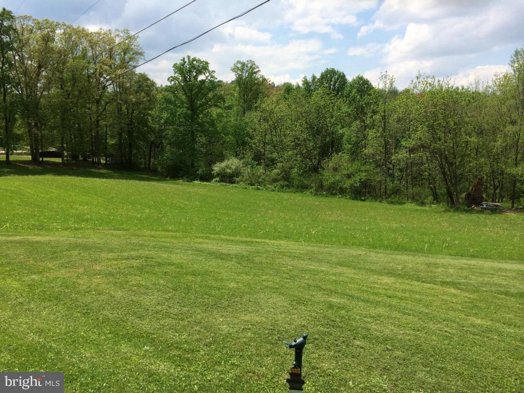 Located between #211 and #217. 3.21 acre building lot with approximately 370 frontage. Open to any builder. Great country location.