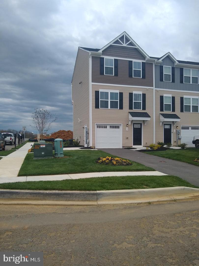 Coming Soon! Don't miss this stunning, sun-filled corner-unit townhouse in the highly desirable Lakes of Martinsburg community. The main level welcomes you with an expansive living room, a convenient half bath, and a beautifully appointed kitchen featuring stainless steel appliances, a stylish backsplash, a center island, and a charming breakfast nook. Upstairs, the layout offers a peaceful retreat with three spacious bedrooms, two full bathrooms, and a dedicated laundry room for ultimate convenience. Enjoy the added privacy of a corner lot alongside fantastic neighborhood amenities, including a dedicated dog park, playground, and picnic pavilion. This turnkey property is the perfect blend of modern comfort and vibrant community living!