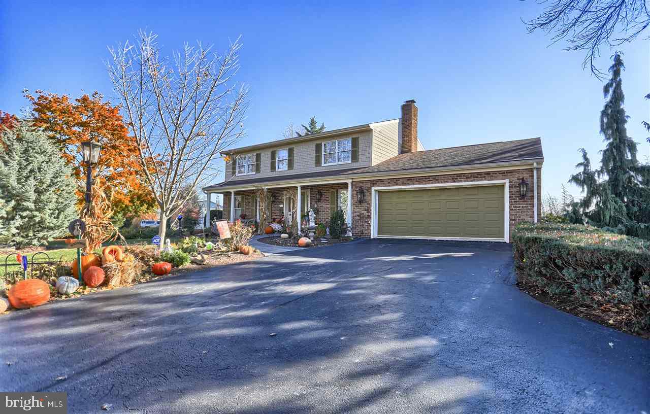 Peaceful setting!  This beautiful 4 bedroom home boast more than 3000 finished sqft.  Attn. car enthusiast! 2 separately attached garages with space to store up to 6 vehicles.  Plenty of room for entertaining with large family room, formal living room, eat-in kitchen and formal dining.  Beautifully landscaped and ready for your final touches.