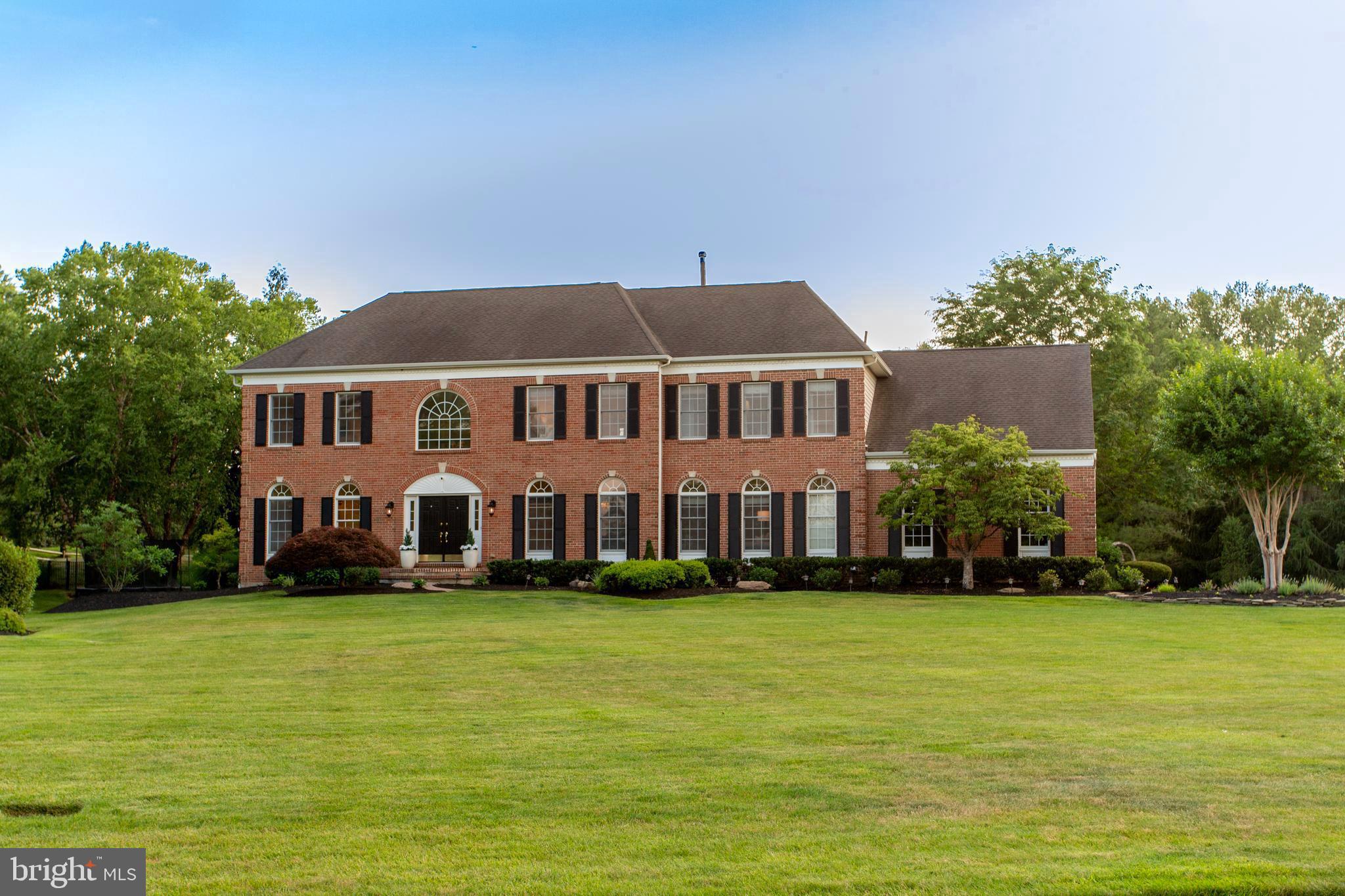 Welcome to 1 Hibbs Lane, a very special Upper Makefield home set on nearly two professionally landscaped acres overlooking Jericho National Golf Club with sweeping sunrise and sunset views. Offering over 6,400 square feet across three finished levels, this 4-bedroom, 4.5-bath property combines generous living space, thoughtful updates, and a floorplan designed for both everyday family life and easy entertaining in one of Bucks County’s most sought-after locations.  A renovated chefs kitchen is truly the heart of the home, featuring a stunning 10-foot honed granite island, custom cabinetry, a 48-inch Wolf range with custom hood, side-by-side Sub-Zero 36" refrigerator & 36" freezer and a butler’s pantry with prep sink. The main level offers a wonderful mix of formal and informal living spaces, including a large, light-filled office, formal dining room, and comfortable family room. Just beyond the kitchen, a cozy den and sun-filled morning room provide two additional gathering spaces that make the home especially easy to live in. Wide-plank white oak flooring, custom millwork, 9-foot ceilings, and abundant natural light carry throughout the home. Upstairs, the expansive primary suite offers a peaceful retreat with a large sitting room or second office, two walk-in closets, and a spacious bath, while three additional bedrooms and two full baths provide ample space for family and guests. The fully finished walk-out lower level adds exceptional flexibility with luxury vinyl plank flooring, a fireplace, wet bar, bonus room, full bath, and direct access to the backyard. Outside, the beautifully renovated heated saltwater pool with raised spa, mahogany deck featuring a new premium Bullfrog spa, brick paver patio, and expansive park-like lawn create a backyard that feels both relaxed and well designed, with lovely golf course views and plenty of room to entertain, play, or simply enjoy the setting. A 3-car garage, new roof slated for summer 2026, and a premier location just minutes to Sol Feinstone Elementary, New Hope, Newtown, and the Delaware Canal Towpath add to the appeal of a home where exceptional design meets inspired living.  Showings begin July 7 -- schedule your private tour and experience the elegance, comfort and lifestyle that makes this rare opportunity truly one-of-a-kind.
