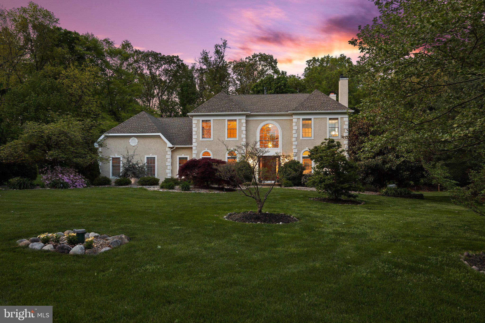 Welcome home to 3435 Sussex Terrace, an immaculate property in the desirable Buckingham Chase neighborhood. Located on a secluded cul-de-sac, this beautiful home sits on just over an acre of meticulously landscaped grounds that back to woodlands. The magazine-worthy, custom Ipe deck with transitional railing will be the backdrop for all your summer entertaining, looking out over the private backyard with raised bed gardens, crepe myrtles, mature trees, and flat, grassy lawn. Upon entering the home through the front door, rich hardwood floors extend through the two-story foyer and into the spectacular chef's kitchen with Subzero refrigerator, Wolf wall oven with convection, Wolf gas range, center island, contrasting white and wooden cabinets, granite counters, plus two spacious pantries. The gleaming hardwoods extend into the adjacent formal dining room features wainscoting, crown molding, and abundant sunlight. Opposite the dining room, the formal living room features a cozy brick fireplace. In the great room, the second fireplace, with stone surround and gas log starter, is the main attraction, with vaulted ceiling and walls of windows. An oversized first floor office with large closet allows ample space for two professionals to work from home. A powder room and laundry room with access to the garage and exterior round out the first floor living spaces. Up the stairs, the expansive primary suite features an oversized sitting area, sprawling walk-in closet, and luxurious bathroom with stall shower, Aquatic Air Massage bathtub, custom dual vanity. Three generously sized bedrooms with large closets share a hallway bathroom with dual vanity. The finished basement will be the backdrop of all your parties, with a kitchenette including wet bar, recreation area for playing cards, and media room warmed by the home's third fireplace. In addition to the gorgeous custom Ipe deck, added bonuses at this property include new air conditioner (2024), new hot water heater (2024), water filtration systems, manual generator transfer switch, 12 x 16' garden shed, as well as natural gas on this street. Assigned to award-winning Central Bucks schools and in close proximity to restaurants and boutiques in Doylestown Borough, schedule your showing while this opportunity lasts.