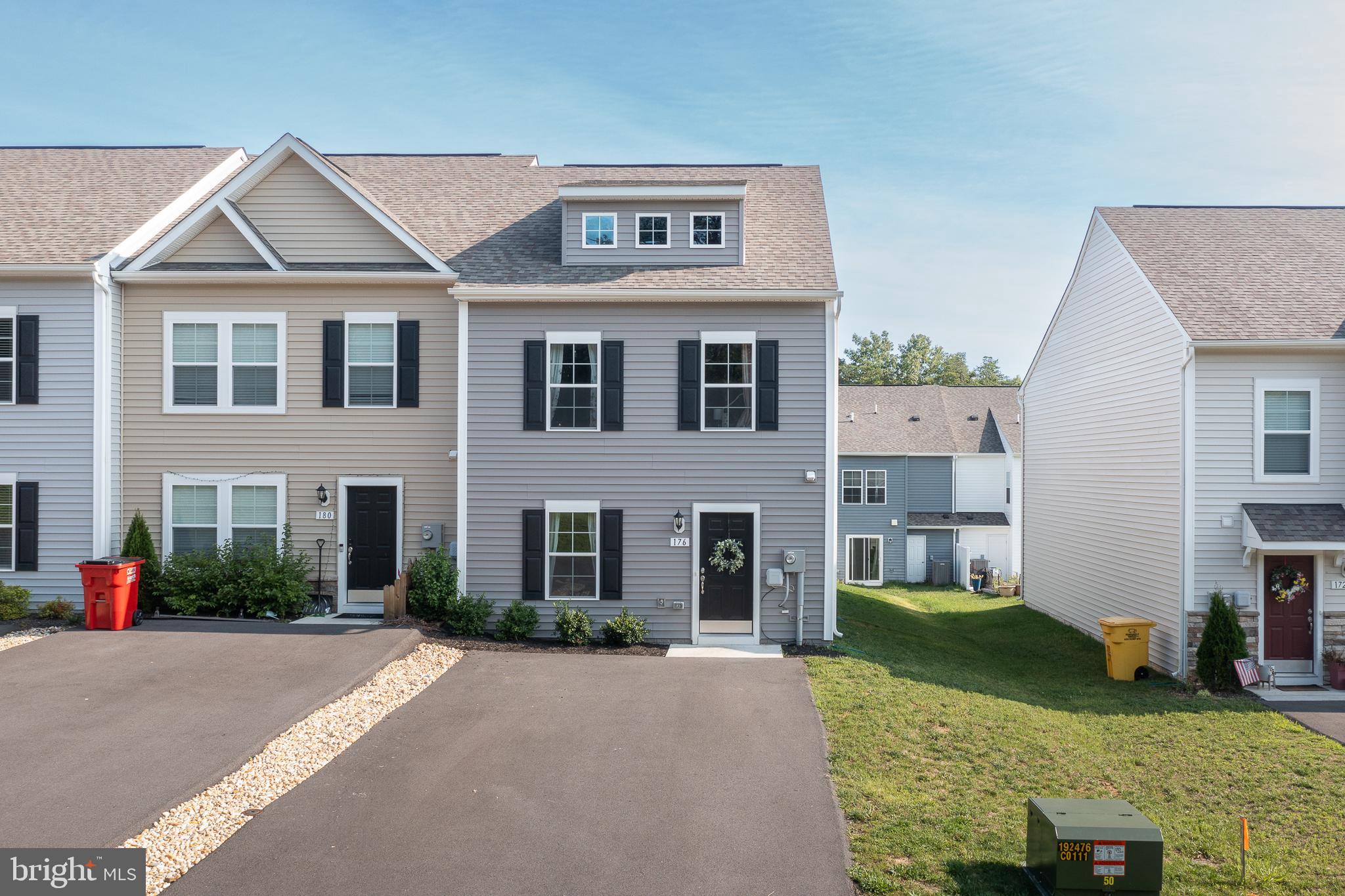 Beautifully maintained end-unit townhome featuring luxury vinyl plank flooring, an open floor plan, and a longer double width driveway for off-street parking. The spacious family room flows seamlessly into the kitchen, where you'll find a large, 8 ft island with seating, quartz countertops, stainless steel appliances, modern lighting and plenty of prep space, perfect for everyday living and entertaining. Upstairs offers three bedrooms, two and a half baths, convenient bedroom-level laundry, and a spacious primary suite with a private en suite bath. Step outside to enjoy the backyard and attached storage shed for extra space. Ideally located just minutes from shopping, dining, outdoor recreation, and major commuter routes, with an easy drive to Charles Town (10–15 minutes) and Winchester (20–25 minutes), and just 10 miles to Locust Golf Course & 17 miles to Loudoun County. Move-in ready and waiting for its next owner!