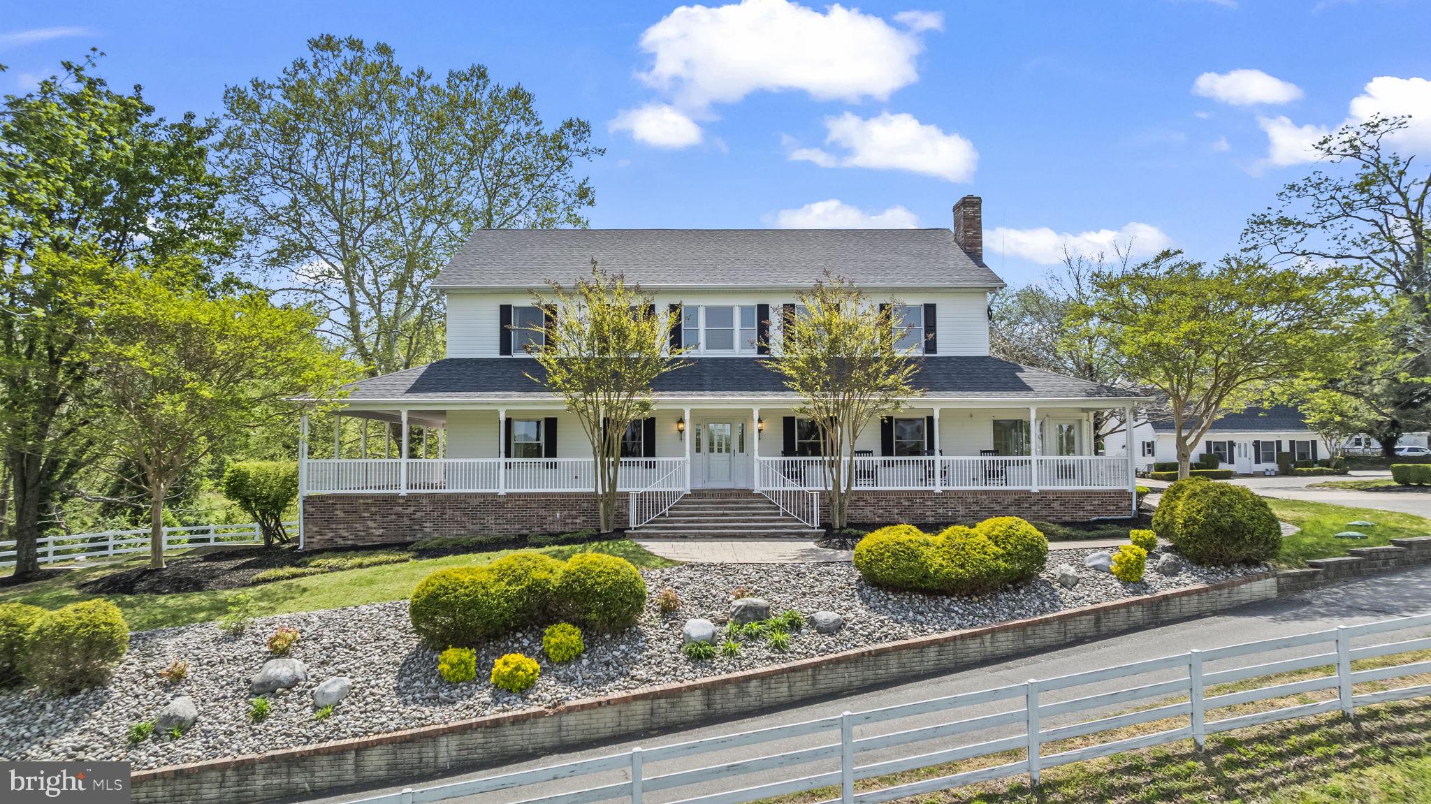 Welcome home to this stunning one of a kind farmhouse set on a picturesque 10 acre landscape, perfect for anyone looking to embrace the charm of rural living. Whether you are dreaming of a private family compound or building long term wealth with multiple rental opportunities, this rare property is full of potential. Picture yourself enjoying your morning coffee on the spacious wraparound front porch while taking in the peaceful views of open fields that could easily accommodate horses, donkeys, or other pasture animals. The front pasture has automatic wells in the field to provide fresh water to livestock. The setting offers a quiet, relaxing escape you will look forward to every day and a babbling brook too. 

Inside, the home opens to a dramatic great room with a floor to ceiling limestone fireplace that immediately catches your eye. Exposed beams add warmth and character, giving the space a truly unique feel. The kitchen is designed for anyone who loves to cook or entertain, with plenty of counter space and cabinets, a commercial grade gas range, warming drawer, and an oversized refrigerator.

The main level features a spacious primary bedroom with a tray ceiling and soft lighting. There is a large walk in closet and two bathrooms, including a full bath with a soaking tub and a large shower with multiple body sprayers. You will also find a generous dining area and a bright three season room surrounded by windows that bring in tons of natural light. A large pantry, a functional laundry room, and plenty of storage throughout make everyday living easy. The three car garage is another great bonus.

Upstairs, there is a comfortable loft area that overlooks the great room and works well as a reading space or hangout area. Two large bedrooms each have walk in closets and share a convenient Jack and Jill bathroom. One of the most impressive features of the home is the indoor pool, measuring 40 by 15 feet. It has been recently updated with new plaster, heater, filter, and UV system in 2025, along with a safety automatic cover so you can enjoy it year round. This space is perfect for gatherings, holidays, or just unwinding at home.
The lower level includes a full in law apartment with its own bedroom, living room, kitchen, bathroom, and laundry, along with a private two car garage and additional storage. It is a great setup for extended family, guests, or rental income.

In addition to the main home, the property includes two separate rental houses with long term tenants already in place. The first offers two bedrooms, a full bathroom, and a kitchen, along with a new roof in 2026 and a new septic system in 2025. The second is a charming Cape Cod with three bedrooms and two bathrooms and has recently updated heating and air conditioning. Both homes have spacious yards and strong income potential that could offset most, if not all, of your mortgage.

This is a rare chance to own a property that offers both lifestyle and income. Whether you want space for animals, room to grow, or a smart investment, this property has it all. With beautiful views, a standout great room, and a unique indoor pool, this is one you will not want to miss.
Main house including pool area: 6772 sqft  Tenant house 1: 1440 sqft  Tenant house 2: 1513 sqft
Priced below recent appraisal.