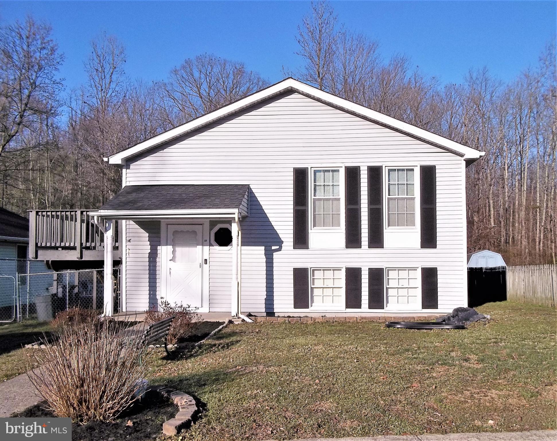 Single family home for a townhouse price! Easy to show and can settle quick. 3 Bedrooms & Full bath, Kitchen & LR on the upper level. Lower level has Bonus Room(Office or Hobby Room), 2nd Full Bath, Large Family Room.  LL storage room (15X12) would make a great work room and has Bilco doors that exit to Back Yard. Large Laundry Room (15X11)  provides lots of storage. Recent Roof,  Most Windows Replaced, Heat Pump new in 2019 and Deck new in 2019. Back Yard is fenced and Shed is included.  Property backs to woods. Convenient Location-Close to APG and Major Roads. No HOA!