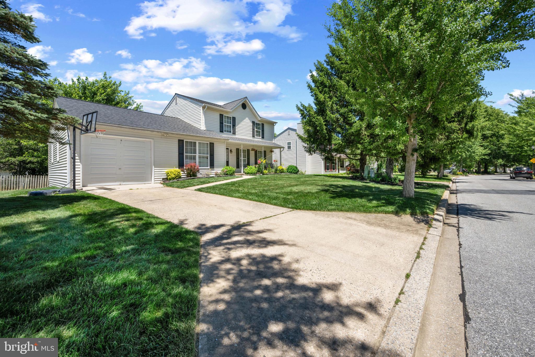 Rarely available in the highly sought-after Roberts Field community! There is nothing to do but move right into this beautifully appointed, turn-key single-family home. From the moment you arrive, the exceptional curb appeal welcomes you, featuring mature landscaping, a garage with a brand-new door opener, and a private driveway with space for two additional cars.

Step inside to a thoughtfully designed main level built for both daily living and elegant entertaining. This floor boasts a formal dining room, an enormous kitchen, and a spacious family room anchored by an operational wood-burning stove—perfect for cozying up on chilly winter nights. From the main level, step out onto an expansive deck overlooking a huge, fully fenced backyard that serves as a private oasis for all your outdoor gatherings and summer BBQs.

Upstairs, the upper level features three generously sized bedrooms, including a premier owner's suite complete with a spacious walk-in closet.

The fully finished walk-out lower level offers unmatched versatility and is beautifully set up as a premium in-law or guest suite. This space features a dedicated family room area, a bedroom with a private en suite bathroom, and provisions already in place for a kitchenette. A separate, fully built-out bonus room is also located on this level, ready to be used as a home office, gym, or media room.

Conveniently located near everything you need yet tucked away in a premier neighborhood, this versatile gem delivers absolute peace of mind with a roof and HVAC system that are both under 5 years old. Welcome home!