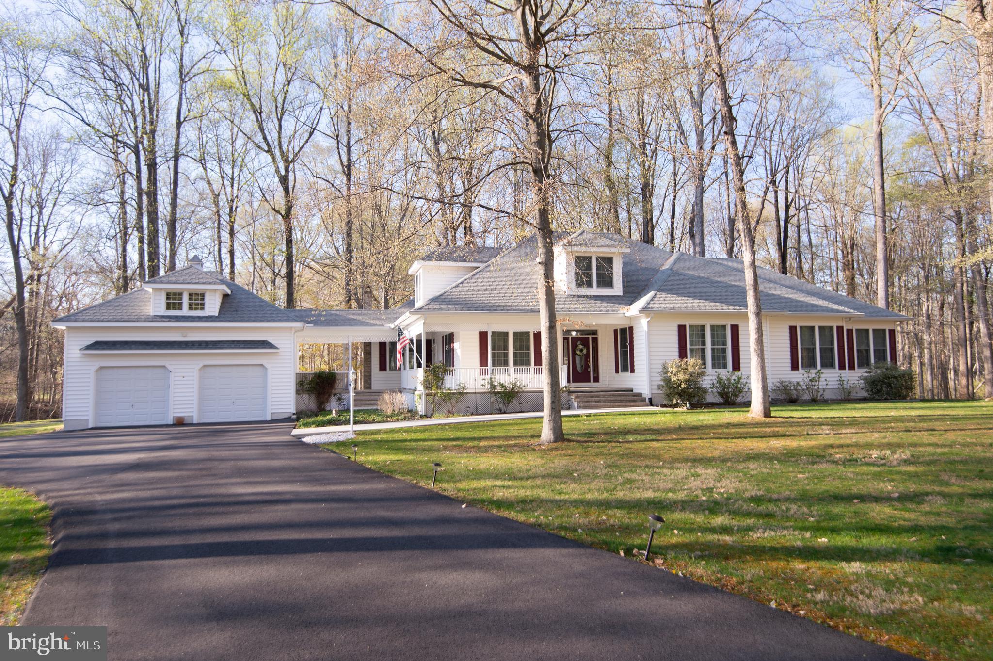 The wrap  around front porch welcomes you to this beautiful, spacious custom built home. Situated in a country setting, but close to everything, on 4.89+/- acres. Need to commute to the Western Shore? Only 30 minutes from the Bay Bridge, an hour from the beaches and a few minutes from Easton. Perfect for the empty nester with 3 bedrooms and 2 1/2 baths on the first floor, and a spacious, airy family room on the second. Growing family? Use the space and full bath on the second floor for another bedroom or workspace.  Entertaining is easy with the lovely open floorplan on the first floor with formal dining room and living room. The well appointed kitchen has a family room and breakfast room adjacent. Enjoy your morning coffee on the three season porch or new cement patio while you gaze at your beautiful  private property. There is a breezeway to the attached garage, and another detached  4 car garage, so there's room for everything. Abundant storage in the house as well, a huge walk in attic, many closets and a basement filled with natural light.