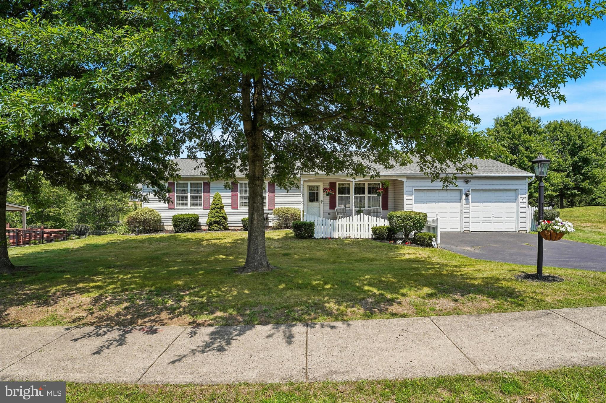 Welcome to 52 Castlewood Drive, a beautifully maintained 3-bedroom, 2-bath ranch in the award-winning Central Bucks School District. Nestled in one of Chalfont Borough's most desirable neighborhoods, this charming home offers the ease of one-floor living with bright, inviting spaces designed for both everyday comfort and effortless entertaining.

Natural light pours into the family room, creating a warm and welcoming atmosphere as you enter the home. The well-appointed kitchen features a center island and opens seamlessly to a sun-filled dining room addition—an ideal setting for family meals, holiday gatherings, and entertaining guests. Sliding glass doors lead to the rear deck, extending your living space outdoors and providing the perfect spot for morning coffee, summer barbecues, or relaxing evenings. The fenced portion of the yard offers a safe, versatile outdoor space that's perfect for pets, a small play area, or gardening.

The private primary suite includes its own full bath, while two additional bedrooms and a second full bathroom offer flexibility for family, guests, or a dedicated home office. The basement provides valuable additional living space, perfect for an additional family room, home gym, playroom, or workspace, along with abundant storage to keep everything organized.

Complete with a two-car garage and situated just minutes from parks, shopping, dining, and major commuter routes, 52 Castlewood Drive combines comfort, convenience, and timeless appeal in the heart of Chalfont Borough. Don't miss the opportunity to make this wonderful home your own!
