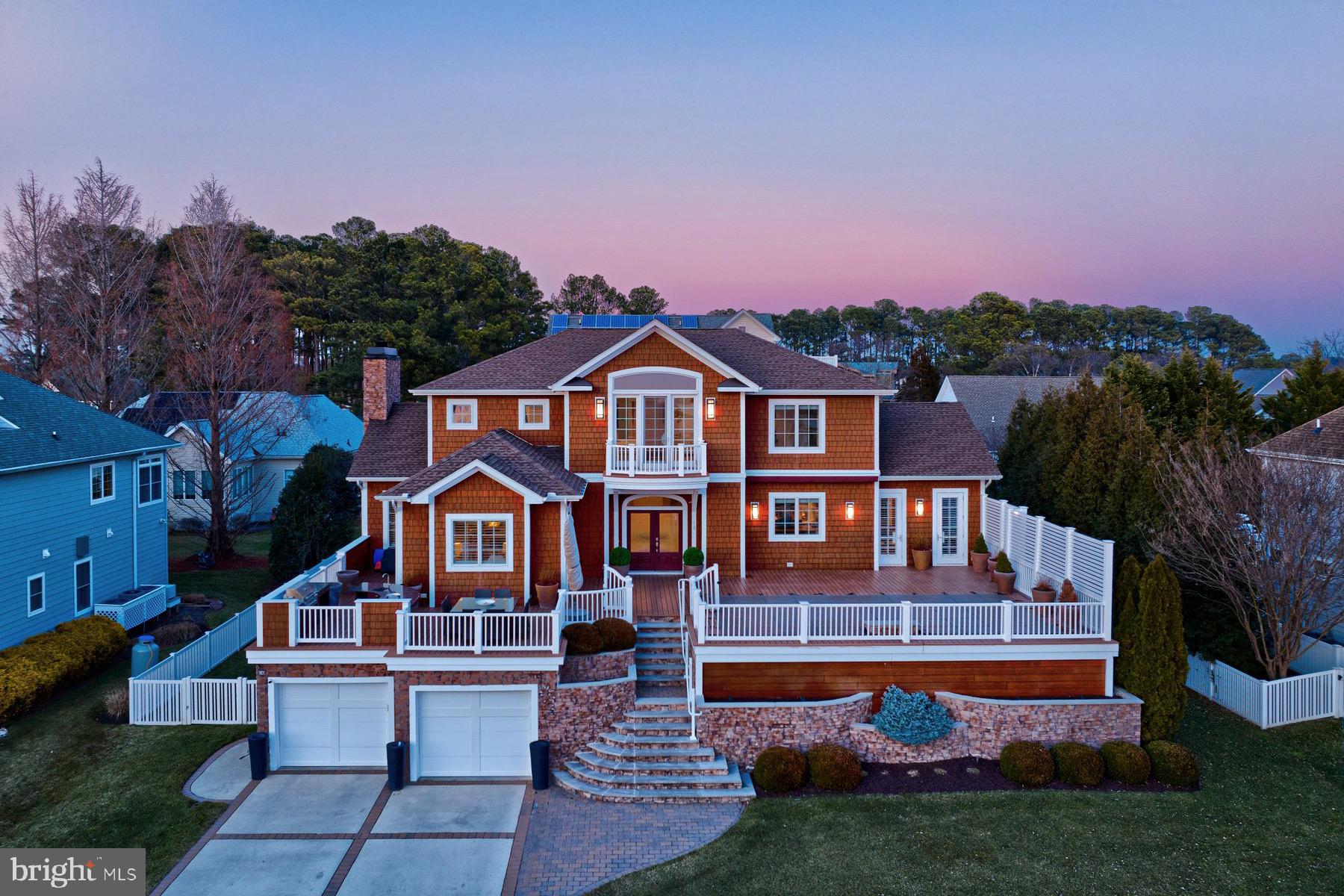This breathtaking custom-built home by Garrison is a rare opportunity to own a luxurious White Oak Road retreat designed for both relaxation and entertaining. Perfectly positioned to maximize bay views and spectacular sunsets, this home features multiple decks and an elevated pool with a waterfall and sun ledge,  set to capture the bay breeze.
Inside, the tall ceilings showcase the open-concept great room, professional chef’s kitchen, and dining room which are perfectly oriented to take in the stunning scenery. The kitchen is a culinary masterpiece, boasting a Sub-Zero refrigerator, Wolf gas range with griddle and  a professional hood, Thermador wall oven,  warming drawer and microwave, and dual dishwashers—ideal for hosting gatherings of any size.
With four spacious bedrooms, each featuring an en-suite bath, plus a private first-floor apartment, this home offers both comfort and privacy for family and guests. An interior elevator provides seamless access to all three levels, ensuring convenience and ease of living.
Designed to embrace both privacy and panoramic views, this exceptional home is a true sanctuary—whether you’re enjoying a sunset cocktail on the deck, lounging by the pool under the retractable awning, or simply soaking in the beauty of the bay. Please see the attached list of additional features in the MLS documents. Too many to list!
White Oak is a hidden bayfront road off West Side Drive, just steps from Rehoboth Country Club. This section of RBYCC is monitored by security cameras and features common areas and parkland along Rehoboth Bay for owners to enjoy. Country Club membership is optional and requires an application process. Square footage per builder: ground floor: 1,257, Second floor: 2,219, Third floor: 1,507. garage: 1,421, Total under roof: 6,410. Total conditioned: 4,983. Pool deck: 1,676. Flood insurance policy transferable for $1,112.00/year. Pool inspection available upon request.