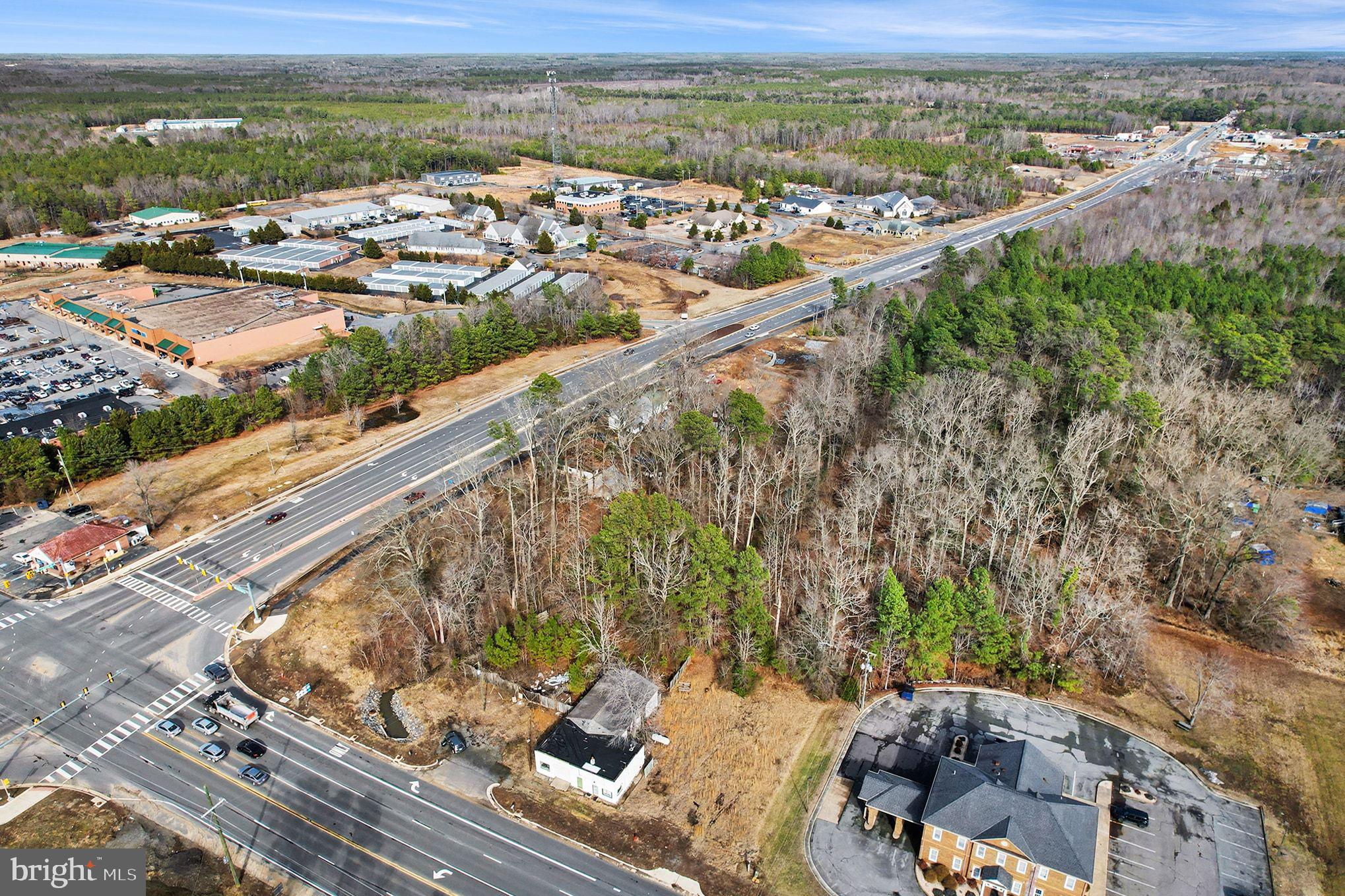 Welcome to the 5 +/- acres at the highly traveled Route 1/Ladysmith Rd. intersection and it is located less than 1 mile from the I-95 exit! This parcel is located on the Southeast corner of Ladysmith Rd. and Route 1 with road frontage on both roads. There are multiple tax parcels included in this sale and they are being sold as a whole. The current zoning of the parcels is a mix between B-1 and RP(Rural preservation), but this land is in the County Comprehensive plan for Community Business, Neighborhood Business, and General Business. This is a fast growing area located between Route 1 and I-95. There have been many recent businesses added or soon to be added along this section of Ladysmith Rd. Bring your vision and ideas for your business here, and take advantage of this opportunity! The house and commercial building located on the property currently will be sold AS IS.
