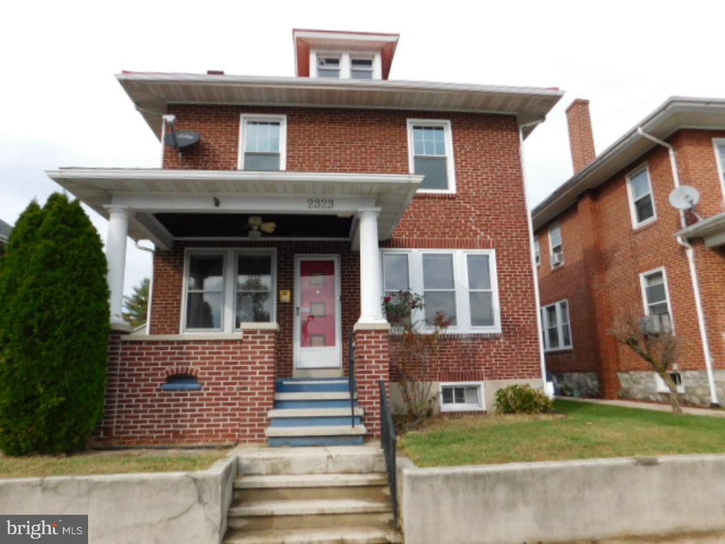 2-story brick home in Wilson School District with 2-car detached garage and finished lower level.