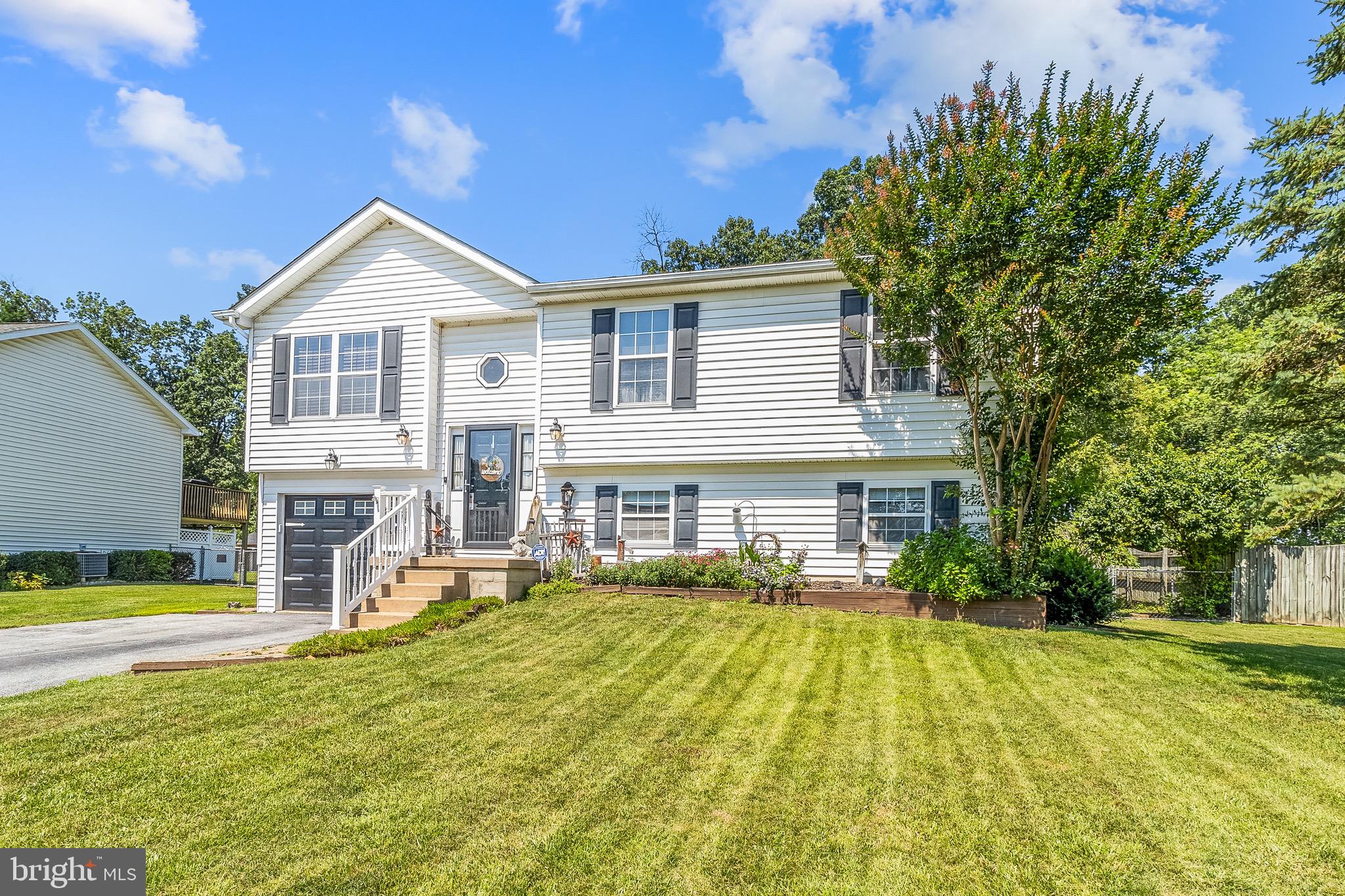 MOTIVATED SELLER OFFERING CLOSING COST ASSISTANCE!!  Welcome to 266 Nottingham Blvd! This one-owner home offers the perfect blend of comfort, privacy, and space. Tucked away with a fenced backyard that backs to mature trees, you’ll enjoy peace and quiet with plenty of room for entertaining. Step outside to find multiple rear decks, ideal for hosting gatherings or simply relaxing in nature. A convenient storage shed adds extra space for your tools and equipment. Inside, you’ll love the open-concept living area with a spacious kitchen island, perfect for casual meals and conversations. The main level features three generously sized bedrooms and two full bathrooms. Downstairs, a finished basement offers flexible living space that could serve as a fourth bedroom, rec room, or home office, complete with a half bath. The attached garage is a standout feature, equipped with its own heating and air conditioning, making it perfect for a workshop, hobby space, or additional year-round storage. Don’t miss this opportunity to own a versatile, well-cared-for home in a peaceful, tree-lined setting!