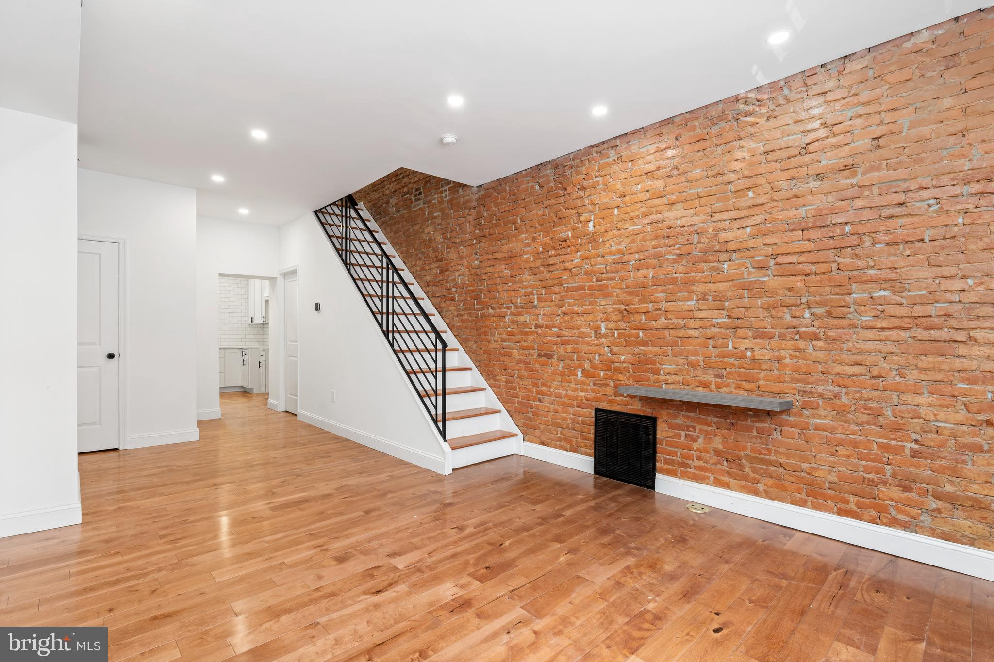 Recently renovated in 2022, 531 Hoffman Street seamlessly blends modern design, thoughtful upgrades, and classic South Philadelphia charm in the heart of South Philadelphia. From the moment you step inside, the home feels warm, bright, and inviting, featuring an open, airy layout accented by rich hardwood flooring, recessed lighting, and exposed brick details that add character throughout.

The stylish galley kitchen was designed with both functionality and entertaining in mind, offering white shaker cabinetry with soft-close drawers, a timeless subway tile backsplash, and direct access to a spacious rear patio. A convenient first-floor powder room adds to the home’s thoughtful layout and everyday practicality.

Upstairs, you’ll find two comfortable bedrooms and a beautifully finished full bathroom featuring subway tile, a sleek glass-enclosed tub/shower combination, and an oversized vanity with excellent storage. The primary bedroom offers a custom accent wall and generous closet space.

Located in one of South Philadelphia’s most exciting neighborhoods, 531 Hoffman Street is surrounded by local cafés, acclaimed restaurants, neighborhood shopping, and beloved city destinations including the iconic Bok Building and Bok Bar, known for stunning skyline views, creative workspaces, dining and coffee shops.