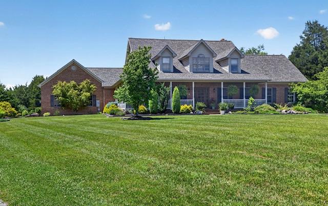 Welcome to 15920 River Bend Court. Custom built by the current owner, this magnificent five-bedroom, six-bath executive home is situated on over nine acres with meticulously maintained lawns, natural wooded areas, and a tranquil stream offering the perfect balance of privacy, space, and convenience.  It is perfect for outdoor enthusiasts, located within minutes to the C&O Canal, boating on the Potomac River, 20 minutes to Whitetail Ski Resort and just minutes from I-70 and I-81. As you drive down the long, winding driveway, you are greeted by the impressive sight of this elegant brick residence. Extensive oriental landscaping outlined by dry stack stone and custom wood fence with gabion posts define the home. There is plenty of sitting space on the Southern inspired wrap-around front porch to sip your morning coffee and listen to the custom waterfall or on the expansive back deck to entertain and watch the amazing sunsets and abundant wildlife. Upon entering the main foyer, you will find the first-floor master suite to your right. This suite includes a walk-in closet, cathedral ceiling, electric fireplace, and en-suite bathroom. The master bathroom has a jetted Jacuzzi tub, ceramic floors, dual sinks, and a shower. The adjacent bedroom will make a perfect nursery or could be converted into your dream walk-in closet with sitting area. There is also a half-bathroom across the hall.  Heading back to the main foyer, you enter an open living area that comprises a den, gourmet kitchen, dining room, and a living room featuring a wood box and wood-burning fireplace. The kitchen is equipped with soapstone countertops, plenty of custom cabinetry, a propane cooktop, ceramic tile flooring, and stainless-steel appliances including double ovens and a large island.  The kitchen patio door opens to the spacious back deck.  The adjoining expansive dining room is designed to accommodate the entire family for both formal and intimate gatherings.  Moving through the kitchen you’ll enter the adjacent hall with front and rear side entrances, oversized two car garage, and laundry area with sink and plenty of cabinets.  The attached garage has custom made knotty alder wood garage doors, wall-mounted tv, two ceiling fans and wifi garage door openers equipped with video for extra added security.  Recessed lighting and hardwood floors accentuate the main level.  Moving up to the second level, the second-floor landing overlooks the main entrance of the home and the main living area. Upstairs are the third and fourth bedrooms both with large walk-in closets, and dormers with window seats. The main full bath and the fifth bedroom with its own full bath complete this level.  Heading down to the lower level, the basement features a spacious family room, rec room, game room – whatever your heart desires.  It has just been finished and includes a large built-in bar ideal for entertaining, along with a half bath, storage area, and utility room. Recent updates include a new roof in 2024, new HVAC system, water softener, and garage doors.  Sure to impress, this exclusive property is meticulously maintained and enjoyed.  Don’t miss seeing this amazing property!  Be sure to call Listing Agent to schedule your exclusive private tour today.  Professional photos and video tour coming soon!