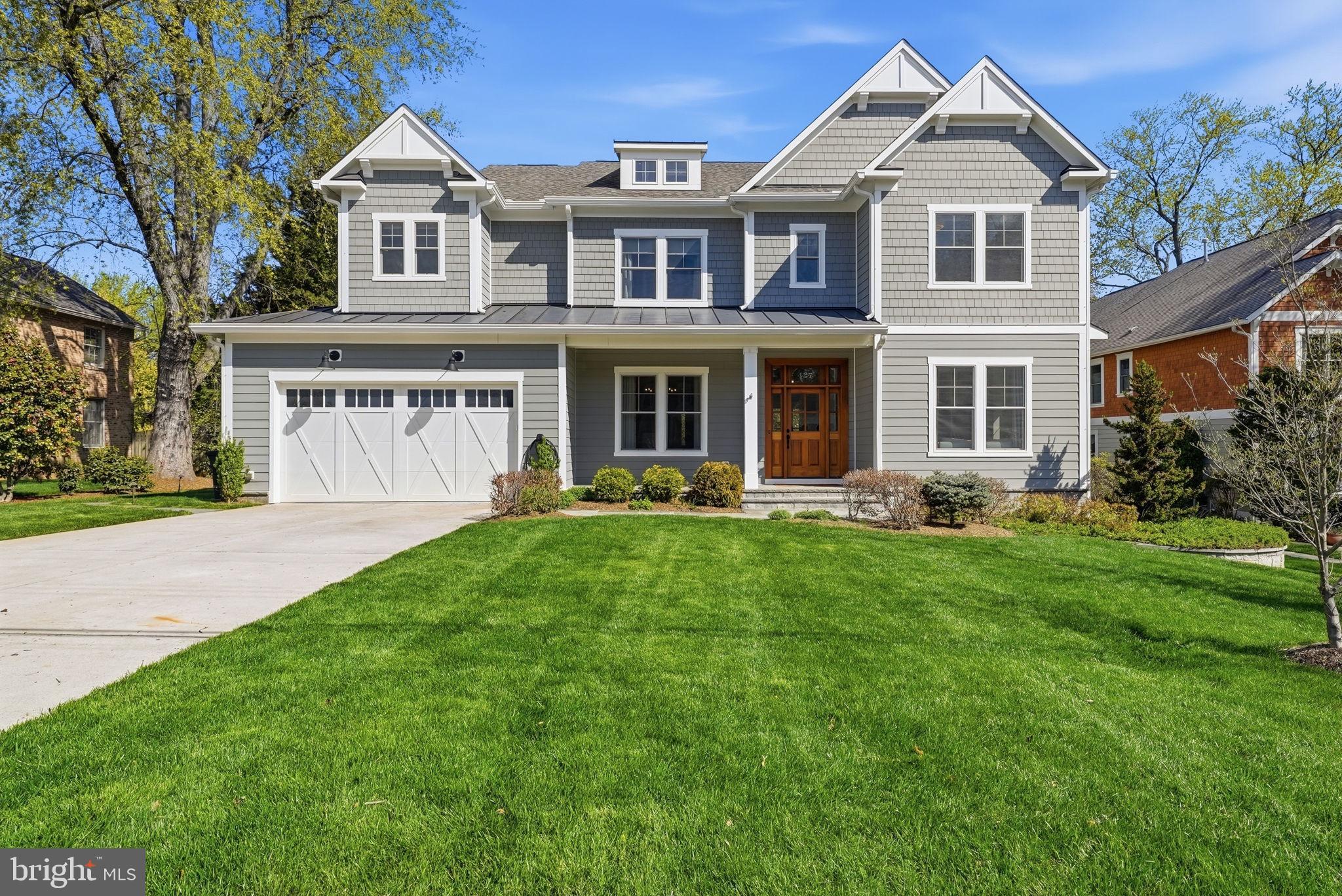 This exceptional luxury residence built by Jefferson Homes showcases outstanding craftsmanship, timeless design, and high-end finishes throughout—all perfectly situated in the heart of downtown Vienna. Professionally decorated and meticulously maintained, this home delivers a refined living experience across three beautifully finished levels.

The main level blends elegance and comfort, highlighted by a stunning family room with a gas fireplace, built-in bookshelves and cabinetry, and a dramatic coffered ceiling accented with designer wallpaper. Custom drapery and a Bose surround sound system with subwoofer create an inviting space ideal for both entertaining and everyday living. The gourmet kitchen is a chef’s dream, featuring an expansive island, farmhouse sink, and a commercial-grade JennAir appliance package, complete with a stainless steel backsplash and warming lamp. A massive walk-in pantry just off the mudroom offers exceptional storage, while the butler’s pantry—equipped with a sink and beverage refrigerator—adds convenience and sophistication. The formal dining room is richly appointed with wainscoting, designer wallpaper, and custom window treatments. A private study/living room with built-ins, cabinetry, and a cozy window seat provides the perfect work-from-home retreat.

Upstairs, a spacious lounge area on the landing offers additional flexibility for relaxation or gathering. The luxurious primary suite is a true sanctuary, featuring a tray ceiling, designer wallpaper, and custom window treatments, along with two generous walk-in closets. The spa-inspired primary bath includes a soaking tub, marble walk-in shower, and a private water closet with a separate sink. Two large secondary bedrooms share a beautifully designed Jack-and-Jill bath, while an additional bedroom includes its own private en suite bath. A well-appointed laundry room with cabinetry and sink completes the upper level.

The fully finished lower level is designed for both entertainment and versatility, offering LVP flooring, recessed lighting, and a wet bar with a full-size refrigerator. A surround sound system enhances the space, while multiple rooms provide flexibility—including a legal bedroom or game room, a unique “science room” with custom cabinetry and tile flooring, an additional bedroom, and a full bath—ideal for guests or extended stays.

Outdoor living is equally impressive with a large, flat backyard featuring a thoughtfully designed hardscape patio with trellis, firepit, and speaker system—perfect for entertaining. Additional features include a WiFi-controlled irrigation system, landscape lighting, gutter guards, and a natural gas line for grilling. The garage is equipped with a 220V outlet for EV charging, an electronic WiFi-enabled lock on the side entry, and additional storage space.

The location is incredible, offering walkability to the shops and restaurants of downtown Vienna, Church Street, the Town Green and the W&OD trail.  A short walk to both Louise Archer Elementary and Madison High School offers major convenience. Close to 66, I-495, Tysons, Dulles Airport and all major commuter routes.