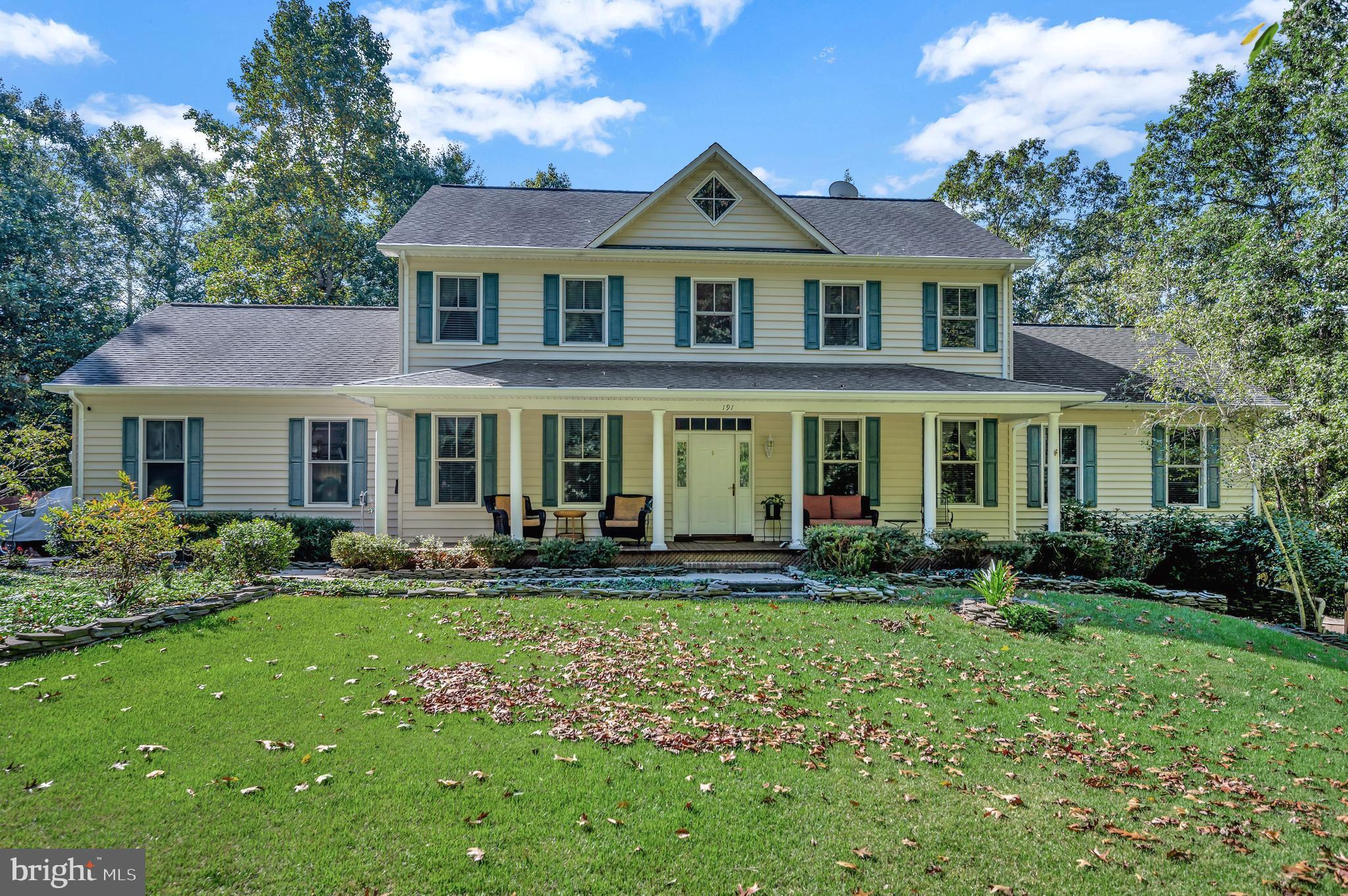 This 3-level Colonial with full front porch on private 4 Acres is a slice of paradise!  Easy access to Route 17 corridor from beautiful Sherwood Estates in Stafford County.  Plenty of back roads to avoid traffic when commuting via I-95 or I-66.  Welcome home to peaceful, quiet, comfortable estate living .  No HOA.  Home is off the road, secluded at end of a long paved driveway.  This well-loved one-owner home with over 5,000 sq. ft. has been thoughtfully maintained and upgraded.  All the rooms are generously proportioned in this 5-bedroom, 4.5 bath 2-story Colonial with fully finished walk-out basement.  Have fun in the 20'x43' pool built into surrounding deck with pool shed and gazebo bolted to the deck.  The pool area has deck lighting on a timer for nighttime ambience.  Enjoy evenings gathered around the fire pit.  Fully fenced rear and side yard is great for dogs.  Relax on full front porch looking out into gardens listening to the gurgling goldfish pond with pump.  There is a gorgeous red maple tree by the pond and others including red bud and cherry trees.  The front door has a glass transom and 2 sidelights.  One of the sidelights opens to expand the width of the front door.  Home has many functional conveniences.  The attached oversized 2 car garage has automatic garage door openers and shelving that conveys.  There is also a detached oversized 1 car garage with electricity providing secure storage on shelving that conveys.  Enjoy peace of mind with whole-house auto-transfer Generac generator on concrete pad.

The entire MAIN LEVEL features 9' ceilings, and wide-plank pine wood floors (including under FR carpet).  Front entrance boasts a 2-story entry foyer with gallery overlook and an impressive wood staircase with brass stair rods to keep carpet runner securely in place.  The separate dining room is great for hosting dinner parties.  The living room and kitchen perimeters are topped with crown molding.  The spacious kitchen has upgrades including a walk-in pantry and 42" cherry cabinets.  Relax in the family room feeling the warmth of the gas fireplace off the open kitchen with dining area.    French doors topped by a glass transom in the family room lead to the 62'x29' sunroom with cooling ceiling fans overlooking the pool area and trees.  The commodious main level primary bedroom has a huge walk-in closet and luxurious en suite highlighted by a corner Swirlbath jetted tub, separate shower with European & rainfall shower, and large linen closet.  The separate laundry room is well-appointed with deep-sink tub, drying racks and cabinets; and conveniently located across from the 1/2 bath and garage entrance off the  kitchen. 

The UPPER LEVEL has four 15'x14' equally sized bedrooms and 2 Jack 'n Jill bathrooms, so each bedroom has an adjoining full bathroom.  Two of the bedrooms have access to the entry foyer gallery overlook.

The LOWER LEVEL is fully finished.  There is a separate Bar/Lounge room through glass French doors with a beautiful oak bar, a Kegerator beer dispenser, wainscoted walls and ceramic floor... terrific for entertaining!   The Recreation room has an attractive corner gas fireplace for your family to gather in an inviting setting.  It also has a 10' closet and tall oak bookcases along a wall.  There is a handsome full bath with ceramic tile shower that has a large glass door and a cedar-lined closet.  There is a storage room with built-in shelving for your storage needs plus the shelving in both garages!  The large built-in Liberty gun safe provides a safe place for your valuables.