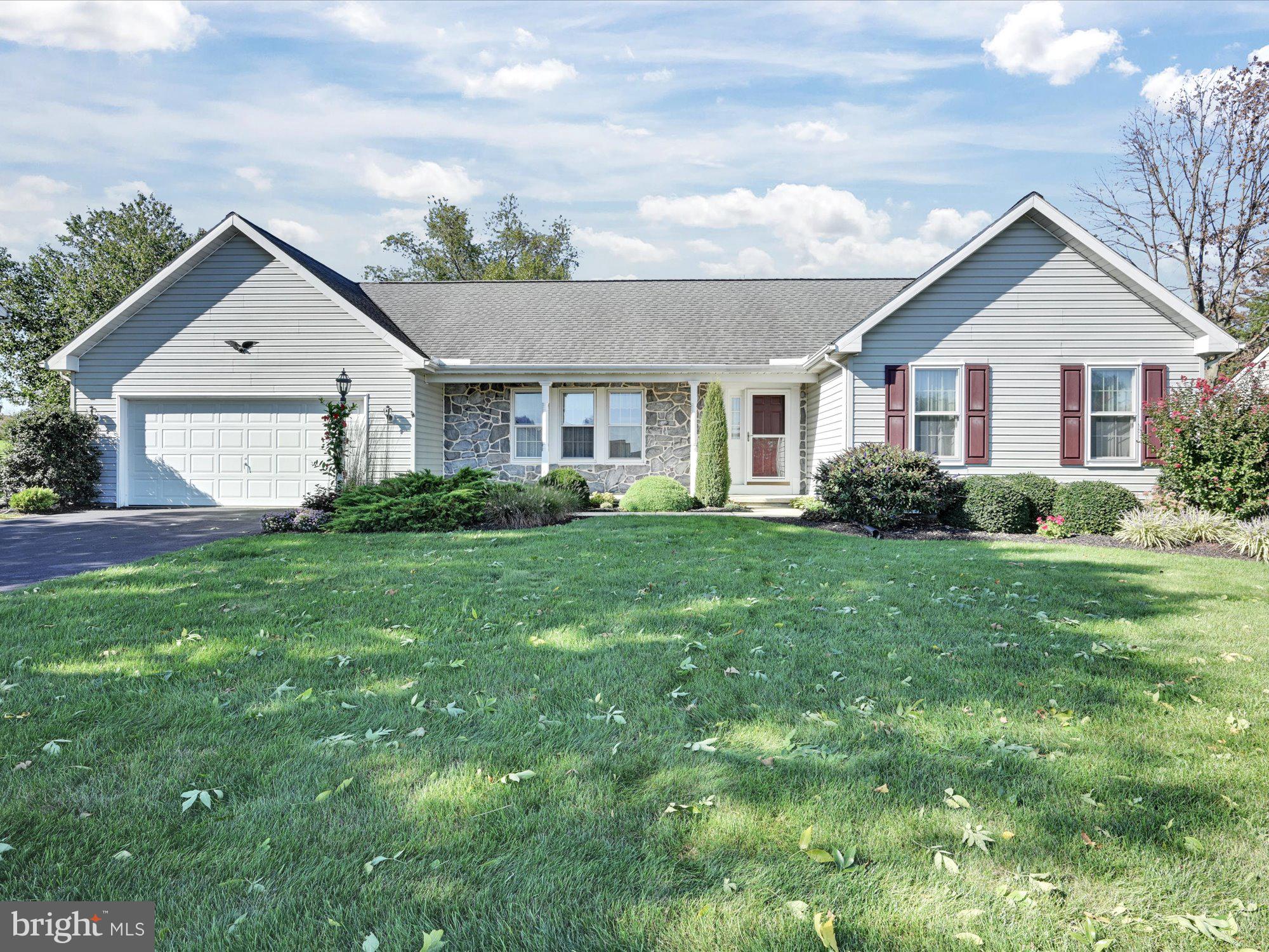 Rare opportunity in New Holland! Beautiful Rancher with a 30x30 addition designed for an In-Law/Guest Suite w/separate entrance, bedroom, family room, small kitchenette and bath. However, this space works beautifully for many other possibilities ( huge fam rm/pool room/game room/or entertaining space). 
The main section of the home offers formal living room, large kitchen and dining area, Primary bedroom/bath, an additional bedroom and main bath, and a four seasons room w/awesome farmland view. Additional features include an extra deep 2 car garage, additional parking pad, front porch, and wrap-around back patio. Must see to appreciate all the space and options.